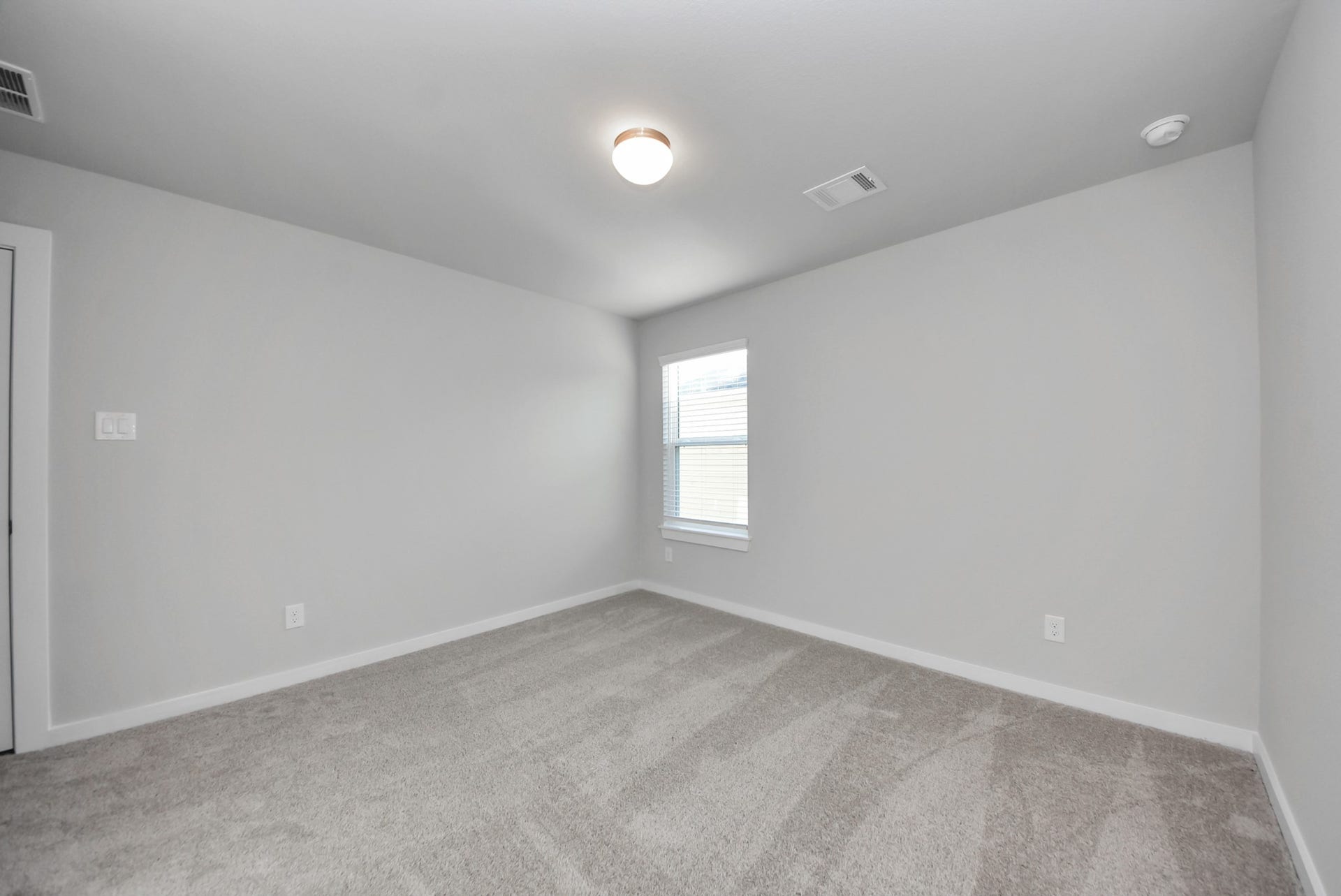 15111 Statice Trail, Houston, TX 77044 Generously sized secondary bedrooms featuring spacious closets, soft and inviting carpeting underfoot, large windows allowing plenty of natural light, and the added touch of privacy blinds for your personal retreat.