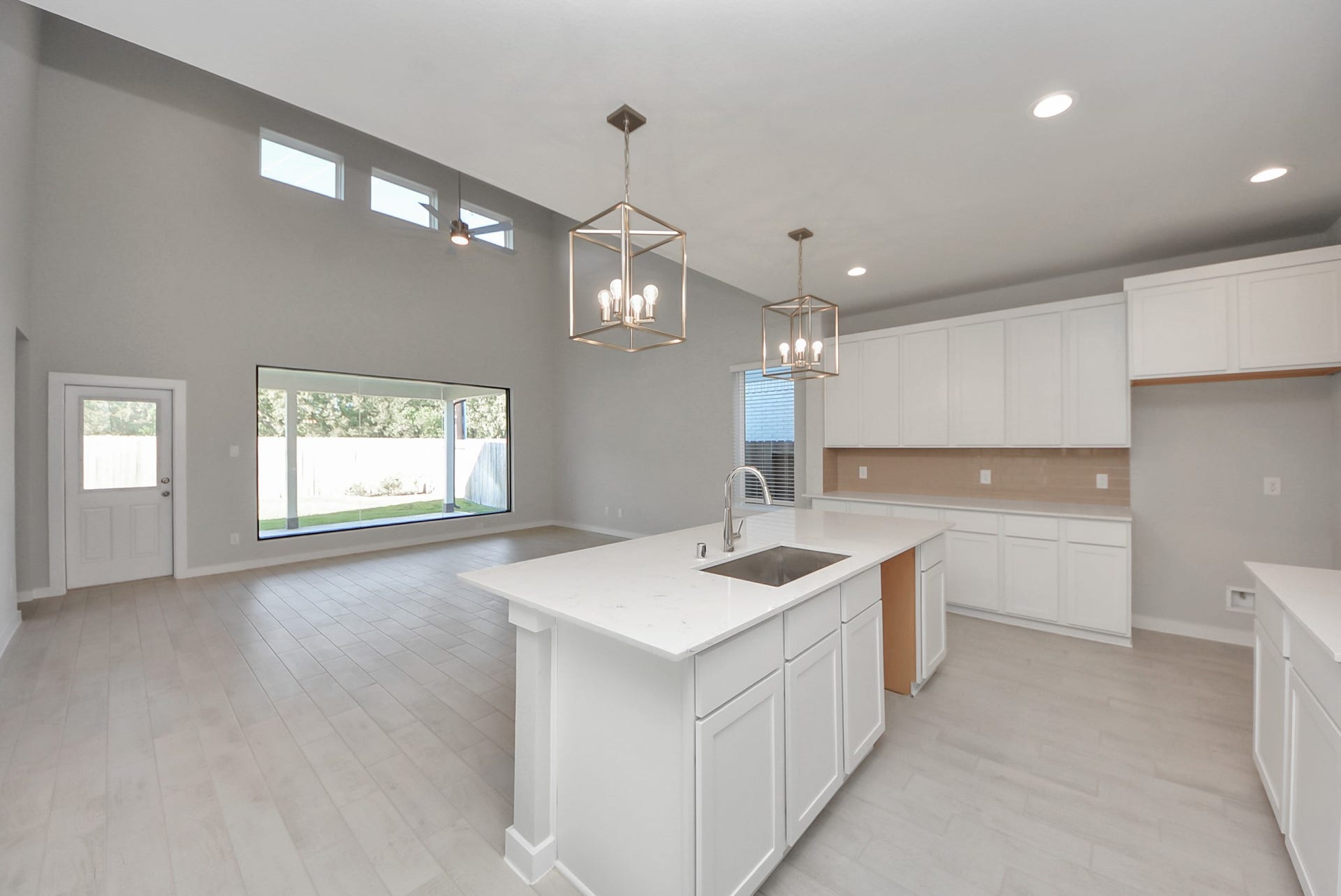 15111 Statice Trail, Houston, TX 77044 All of this overlooks your expansive family room, creating a perfect space for culinary delights and family gatherings.