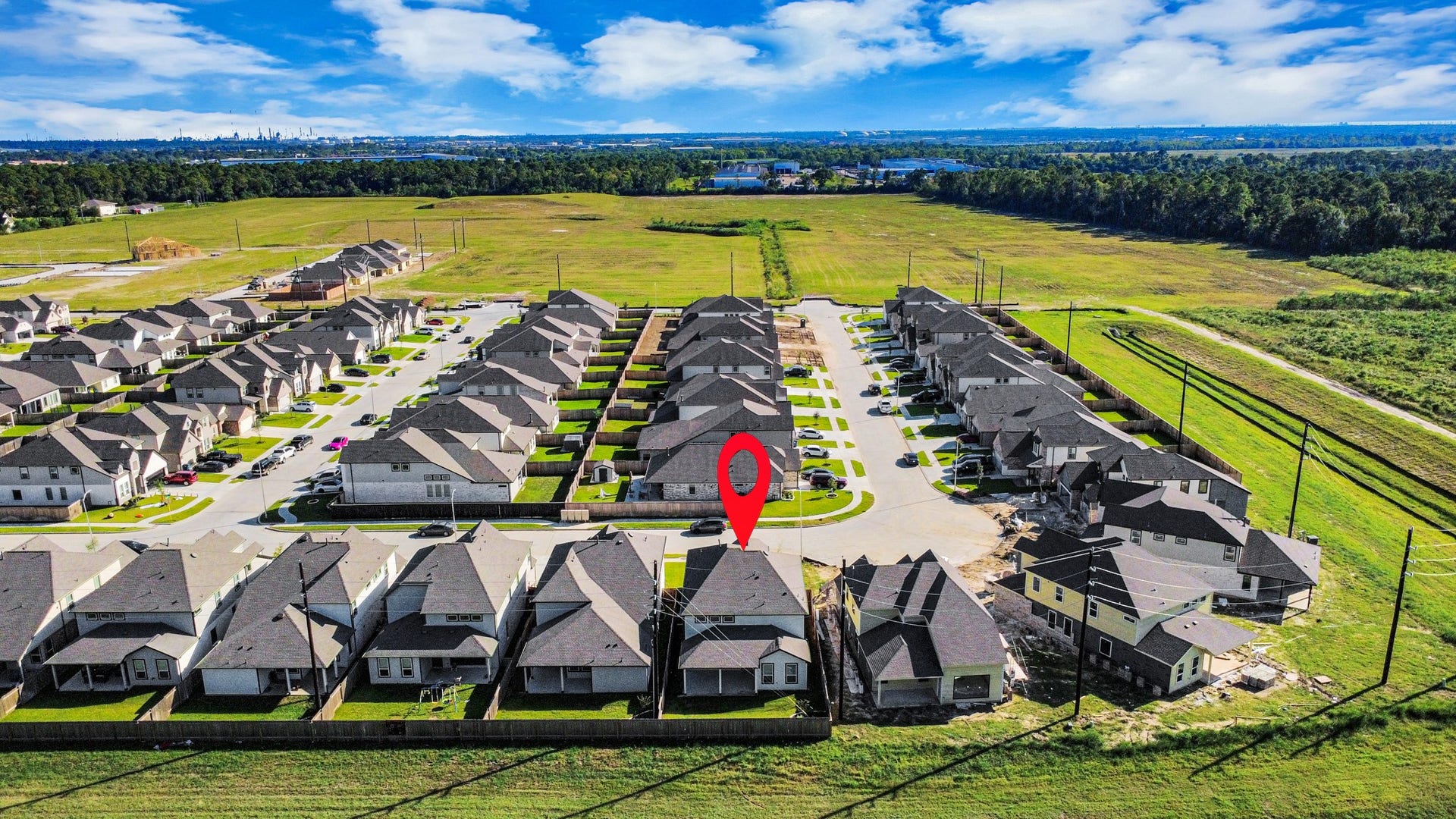 15111 Statice Trail, Houston, TX 77044 An aerial view of a spacious subdivision lot, highlighting a well-maintained yard and a fully fenced perimeter, offering both privacy and expansive outdoor space.