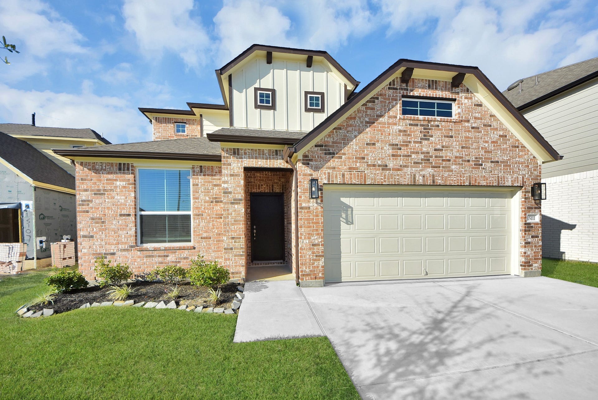 15111 Statice Trail, Houston, TX 77044 The residence features a practical 2-car garage complemented by a generous driveway, ensuring abundant space for parking needs.