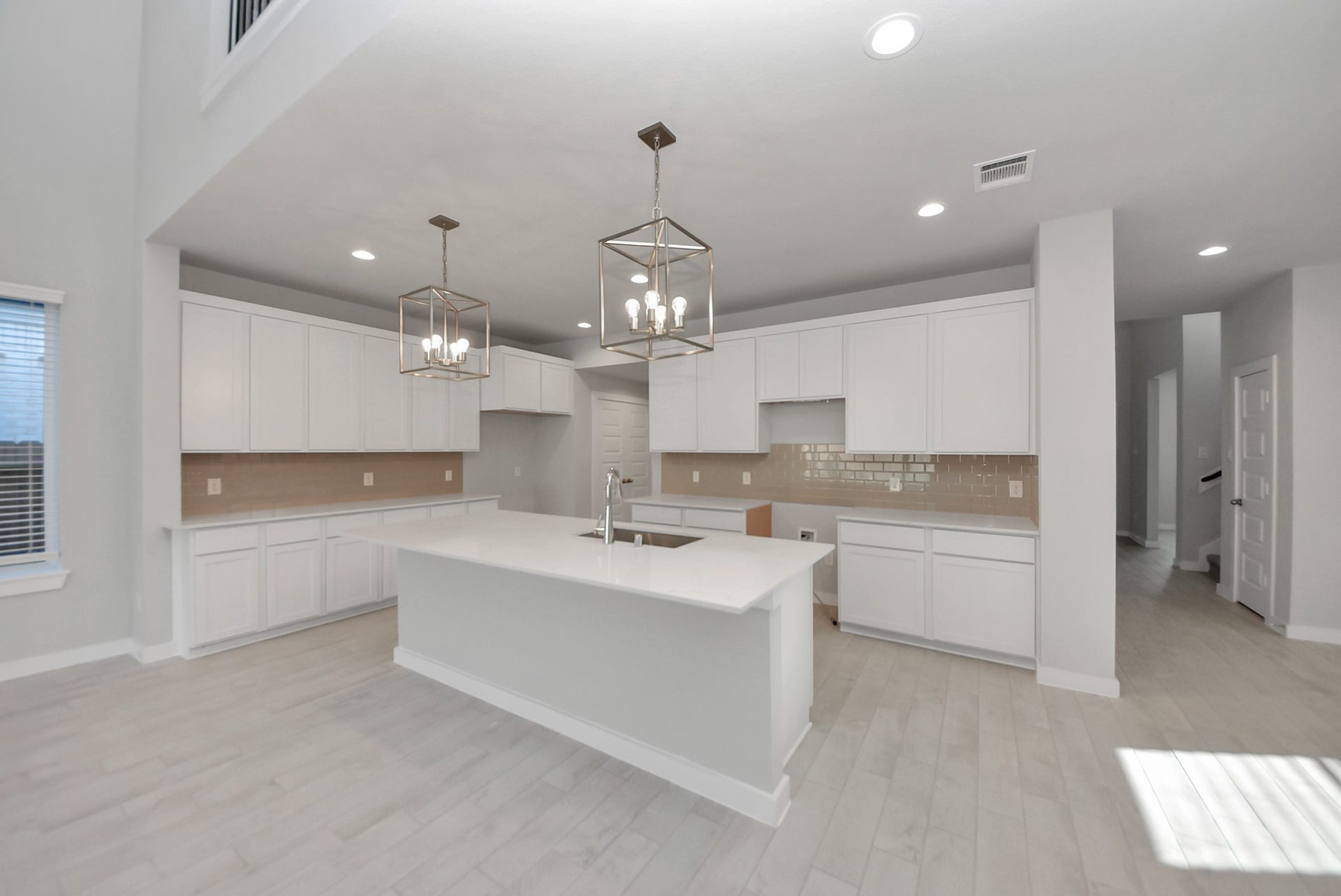 15111 Statice Trail, Houston, TX 77044 The kitchen is a culinary haven, featuring granite countertops, a tile backsplash, stainless steel appliances, 42 upper cabinets, and undercabinet lighting.