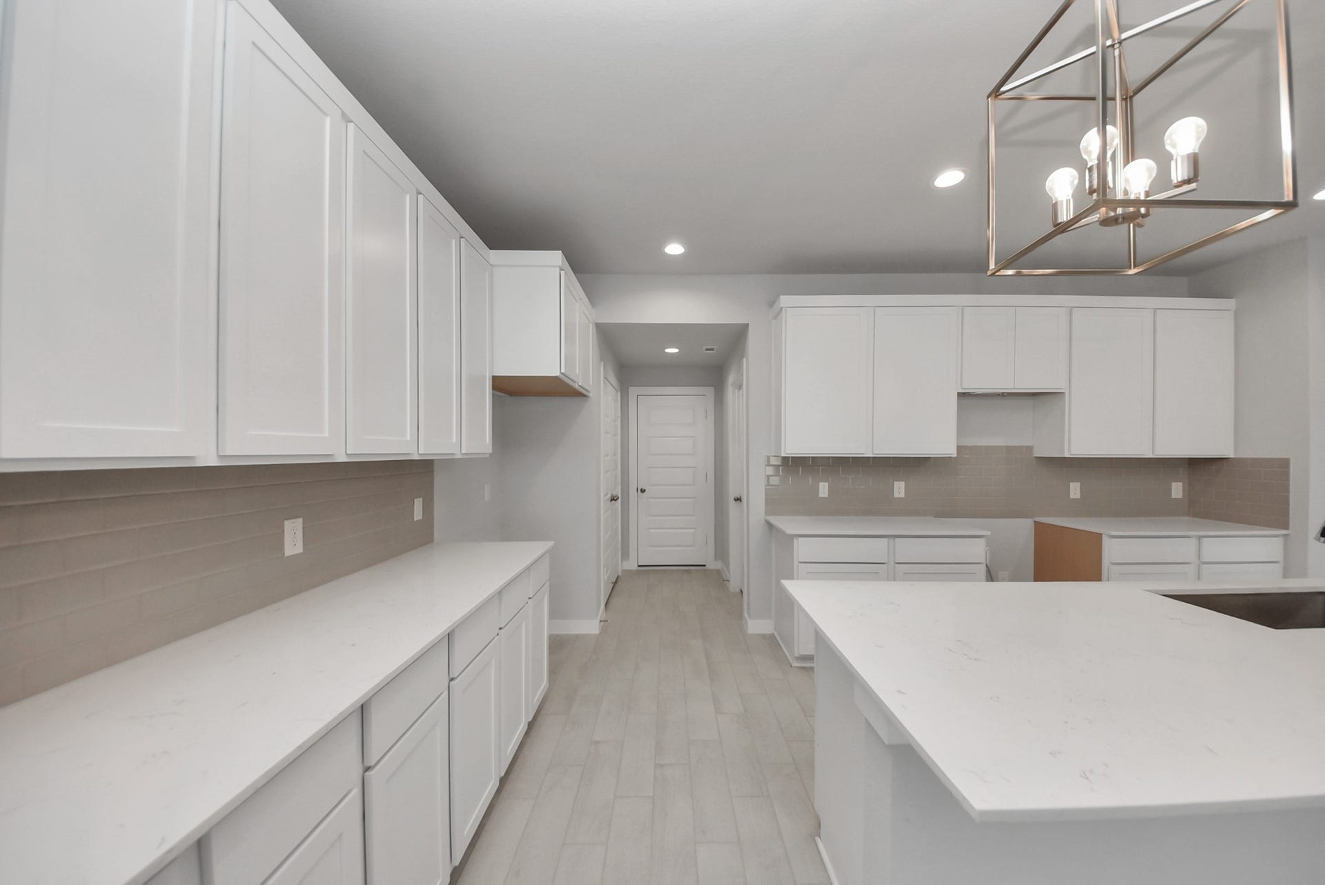 15111 Statice Trail, Houston, TX 77044 The extended counter area adds both practicality and style, making meal preparation a breeze. Every detail is thoughtfully designed to enhance the kitchen's functionality and aesthetic appeal.