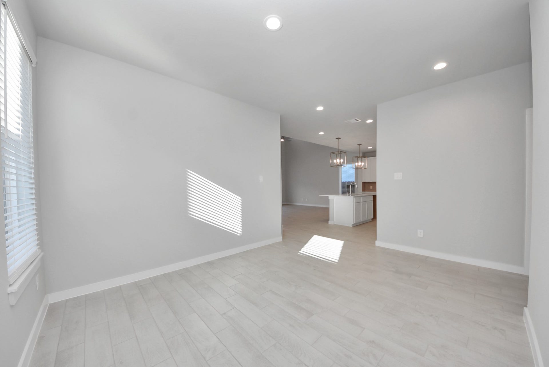 15111 Statice Trail, Houston, TX 77044 Make memories gathered around the table with your family and friends! This spacious dining room features elegant flooring, custom paint, and adjacent to family room and kitchen for open concept feel.