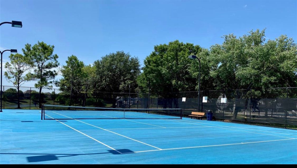 Shadow Creek Ranch residents enjoy access to community tennis courts, providing a great setting for recreational play & friendly competition! The fenced courts feature a bright blue playing surface, surrounding lighting & convenient seating, adding to the impressive selection of neighborhood recreational amenities.