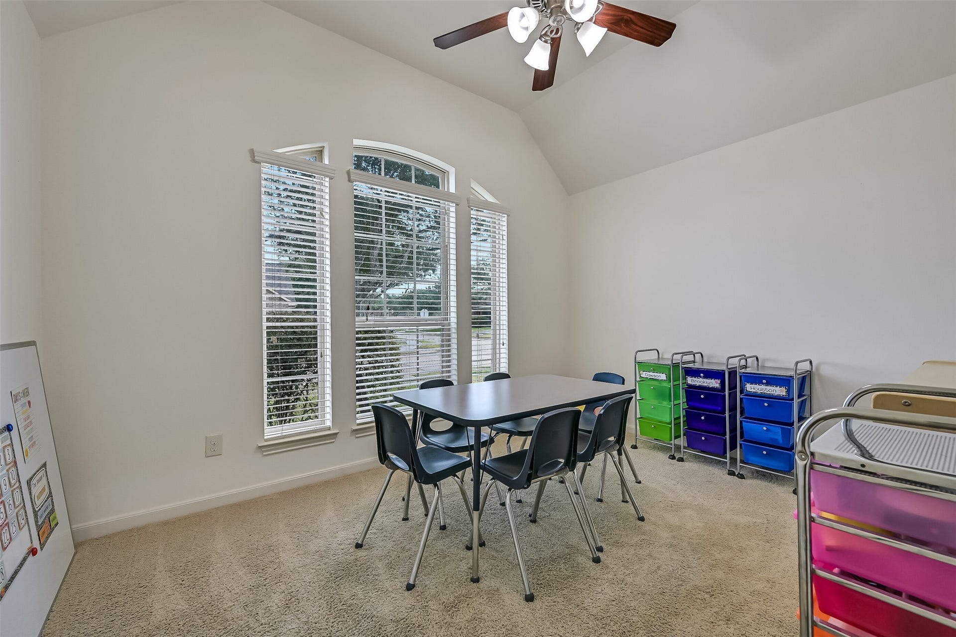 This versatile secondary bedroom features a dramatic arched window, vaulted ceiling, neutral carpeting & a ceiling fan. Currently arranged as a learning space, the room offers plenty of flexibility for a bedroom, home office or hobby room. A generous walk-in closet provides valuable storage!