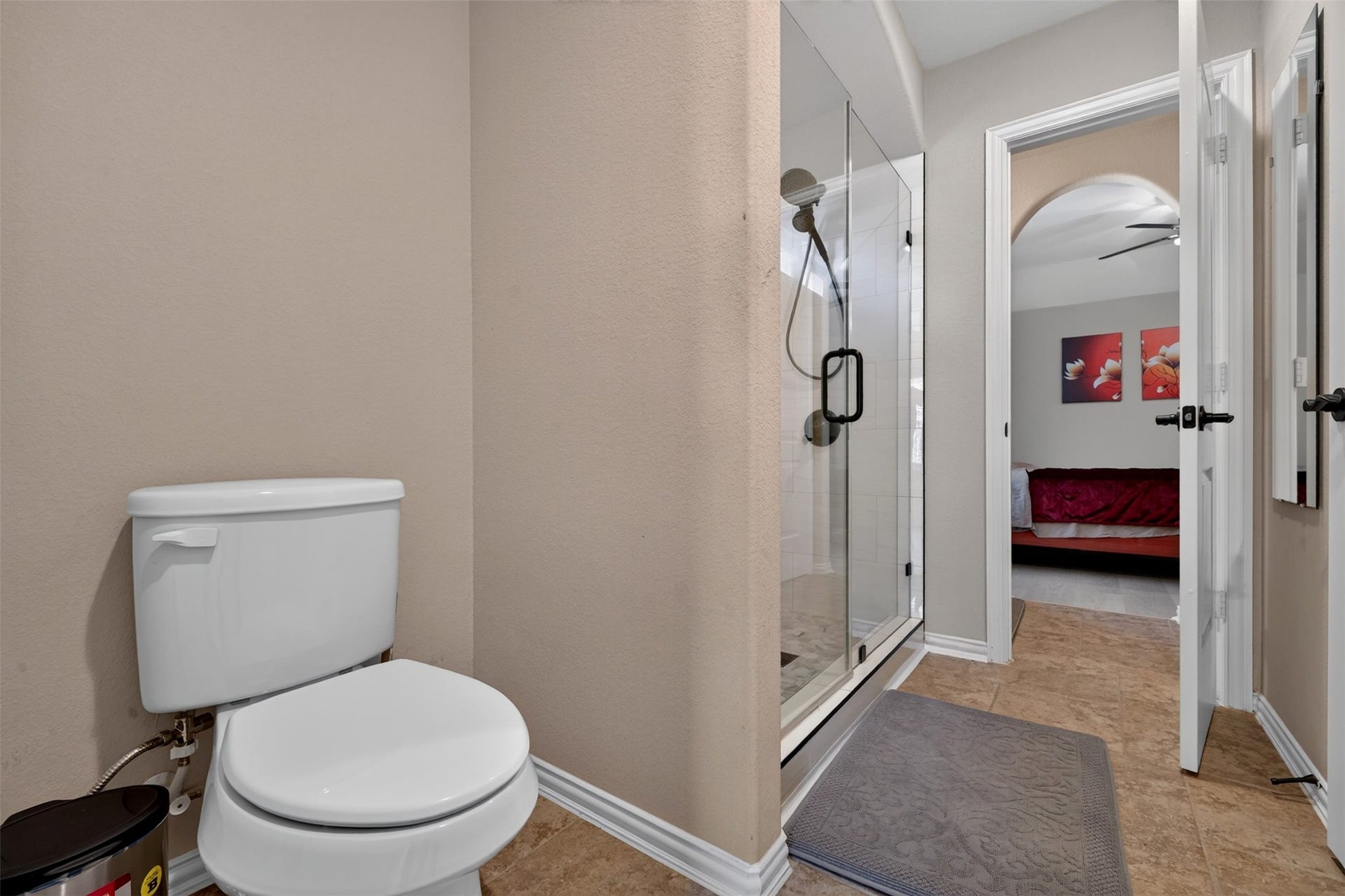 27818 Burchfield Grove Lane, Katy, TX 77494 This bathroom features a separate water closet and a walk-in shower, creating a functional layout for daily routines.