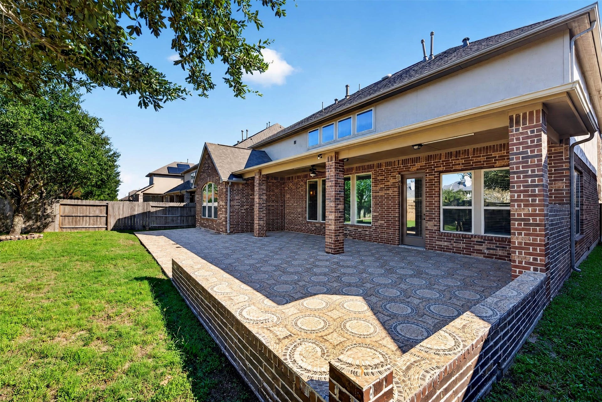 27818 Burchfield Grove Lane, Katy, TX 77494 There's plenty of room to arrange multiple seating areas or an outdoor dining setup. Brick columns and the extended roofline provide a cohesive architectural finish.