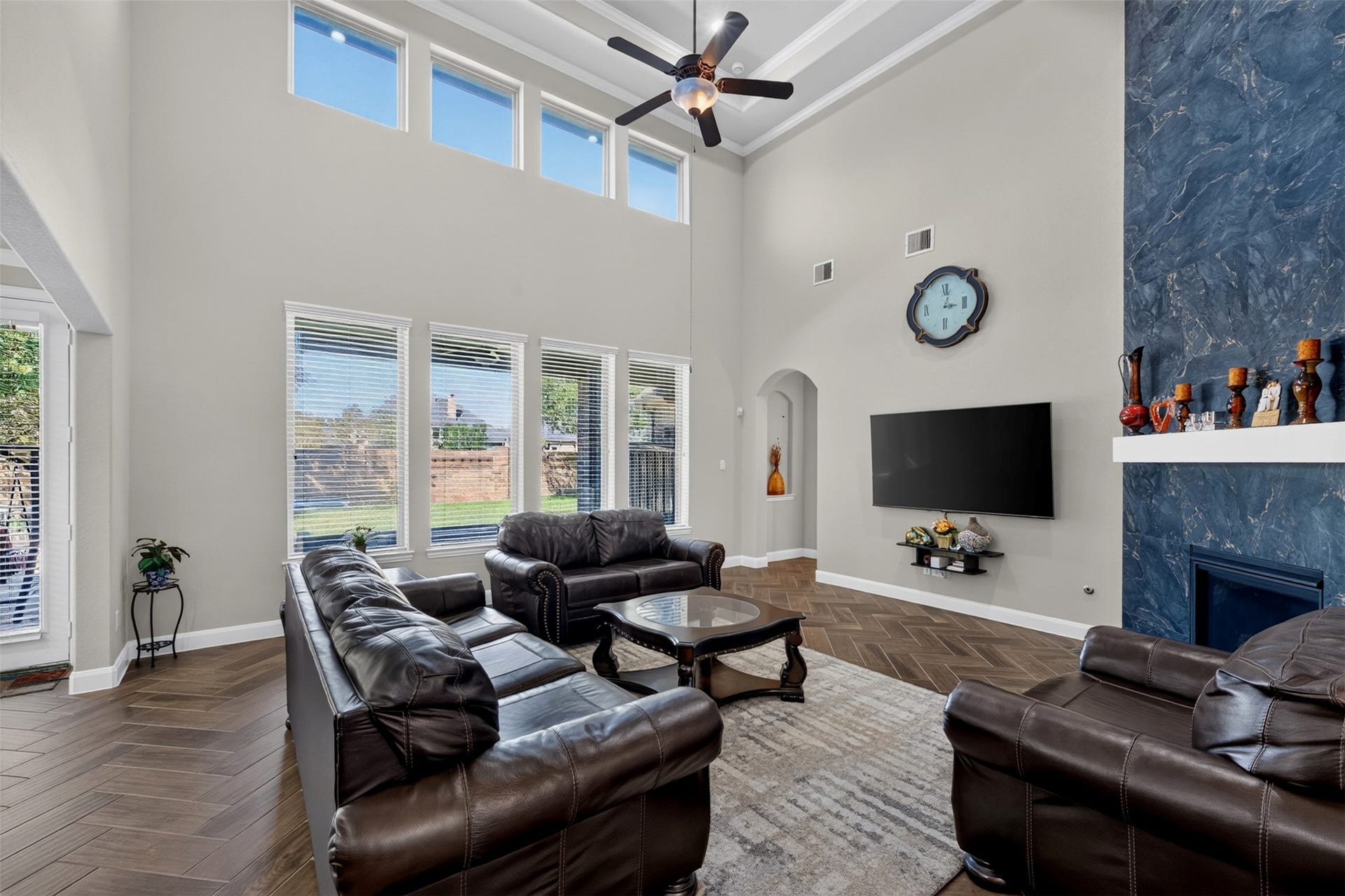 27818 Burchfield Grove Lane, Katy, TX 77494 The family room makes a dramatic impression with soaring ceilings, tall windows, and an abundance of natural light. The open layout offers plenty of room to relax and gather.