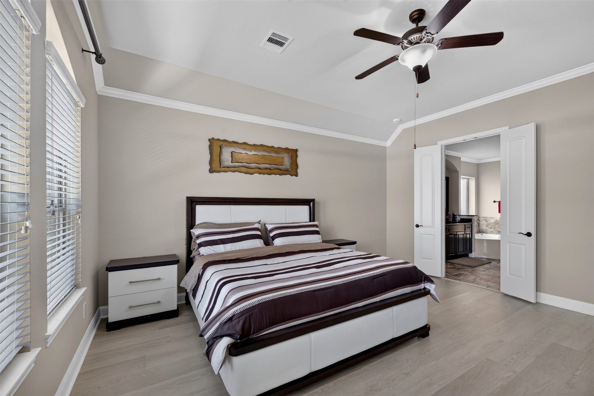 27818 Burchfield Grove Lane, Katy, TX 77494 A closer look reveals the bedrooms generous proportions, with plenty of room to relax and unwind. The double-door entry to the ensuite bath adds convenience and an easy flow between spaces.