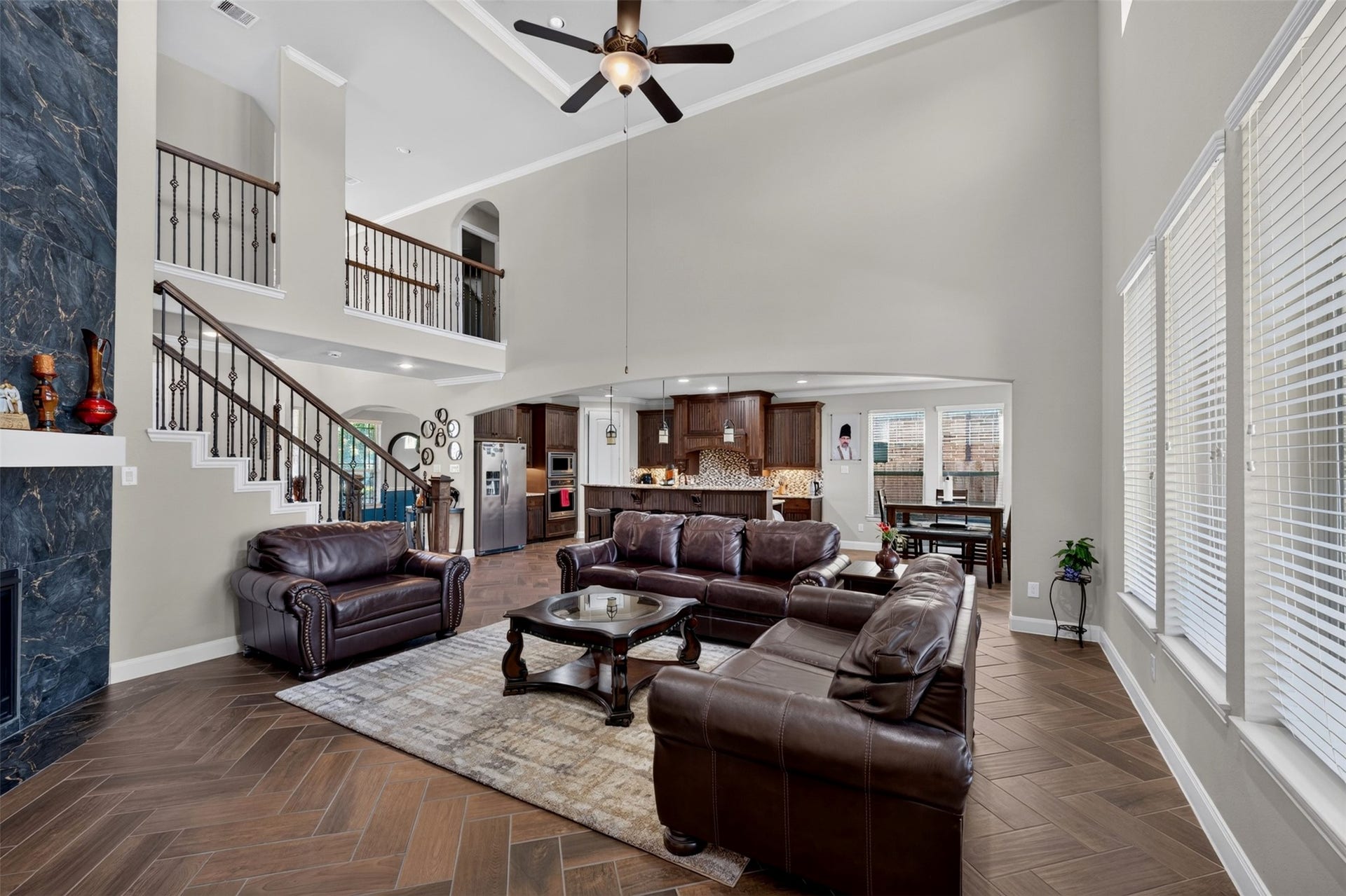 27818 Burchfield Grove Lane, Katy, TX 77494 This wider view showcases the seamless connection between the family room and kitchen. The open-concept design encourages easy conversation and entertaining.