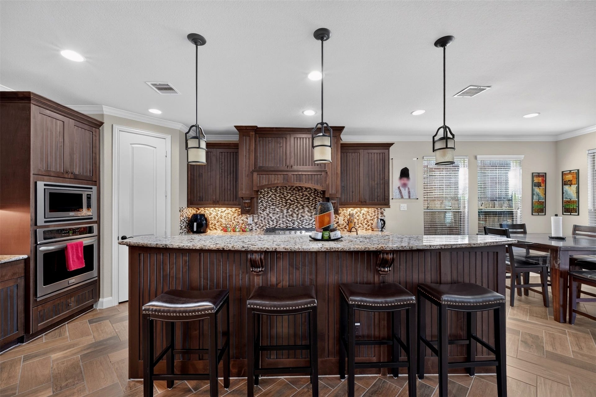 27818 Burchfield Grove Lane, Katy, TX 77494 The expansive island takes center stage, offering generous countertop space for meal preparation, serving, and conversation. Bar seating makes it easy for guests to gather nearby while the cook puts the finishing touches on dinner.