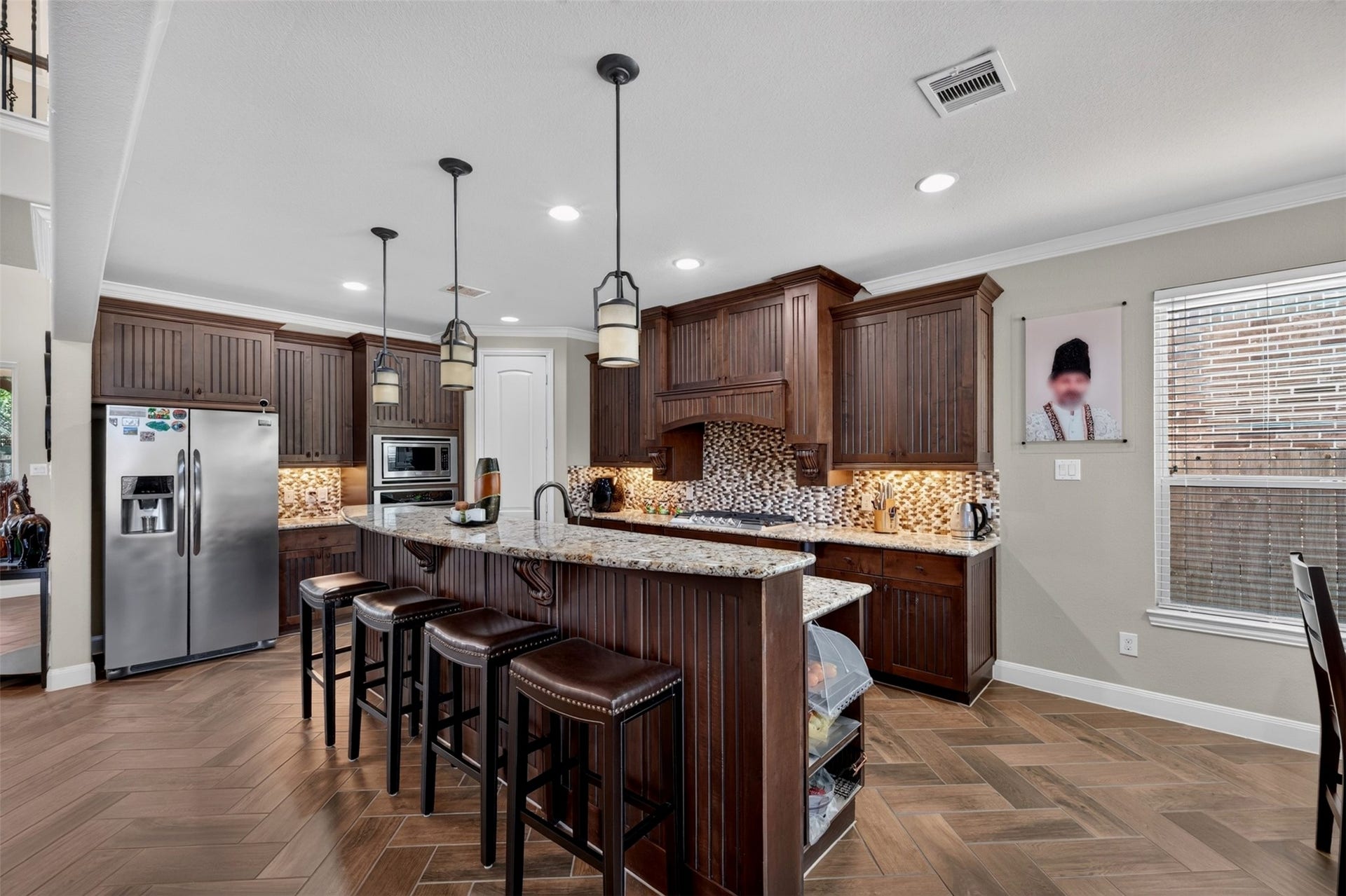 27818 Burchfield Grove Lane, Katy, TX 77494 The kitchen flows effortlessly into the breakfast area, creating an inviting space where meal preparation and everyday dining come together.