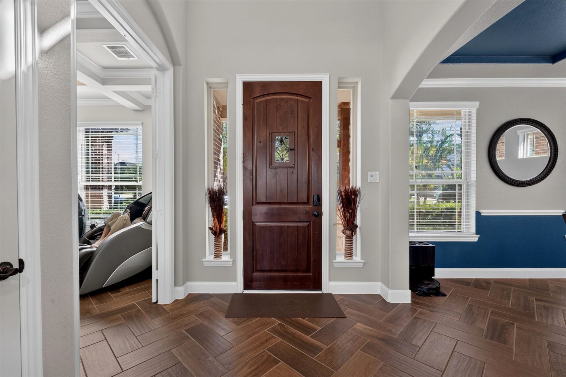 27818 Burchfield Grove Lane, Katy, TX 77494 Step through the front door and into a welcoming entry that immediately sets the tone for this gorgeous home. Elegant sidelights invite natural light inside, while the herringbone-pattern wood-look tile creates a stylish first impression and leads you toward the home's inviting living spaces.