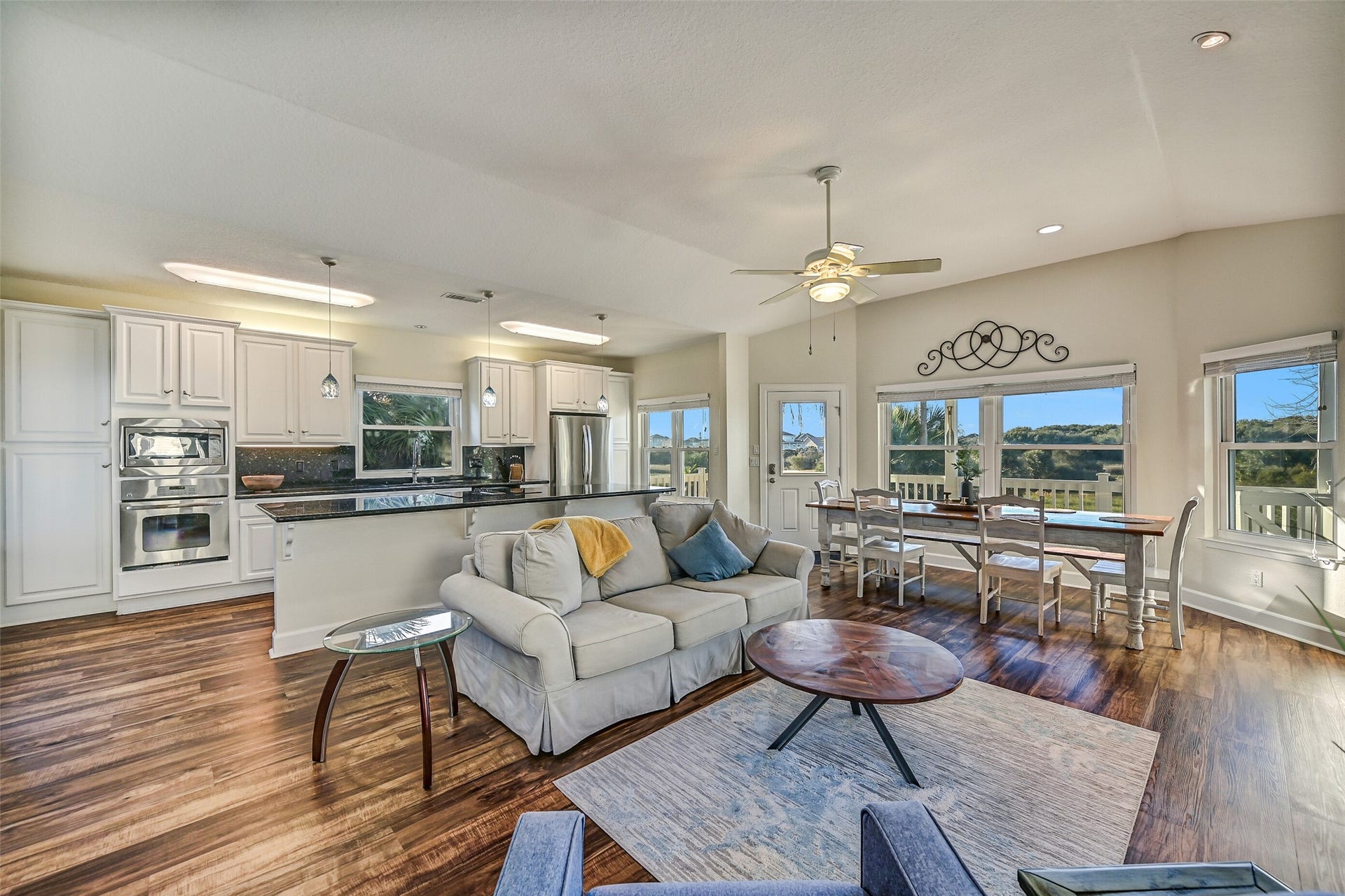 13414 Binnacle Way, Galveston, TX 77554 The ground level hosts an open kitchen, living, and dining room, a half bath, laundry room, and the expansive primary suite.