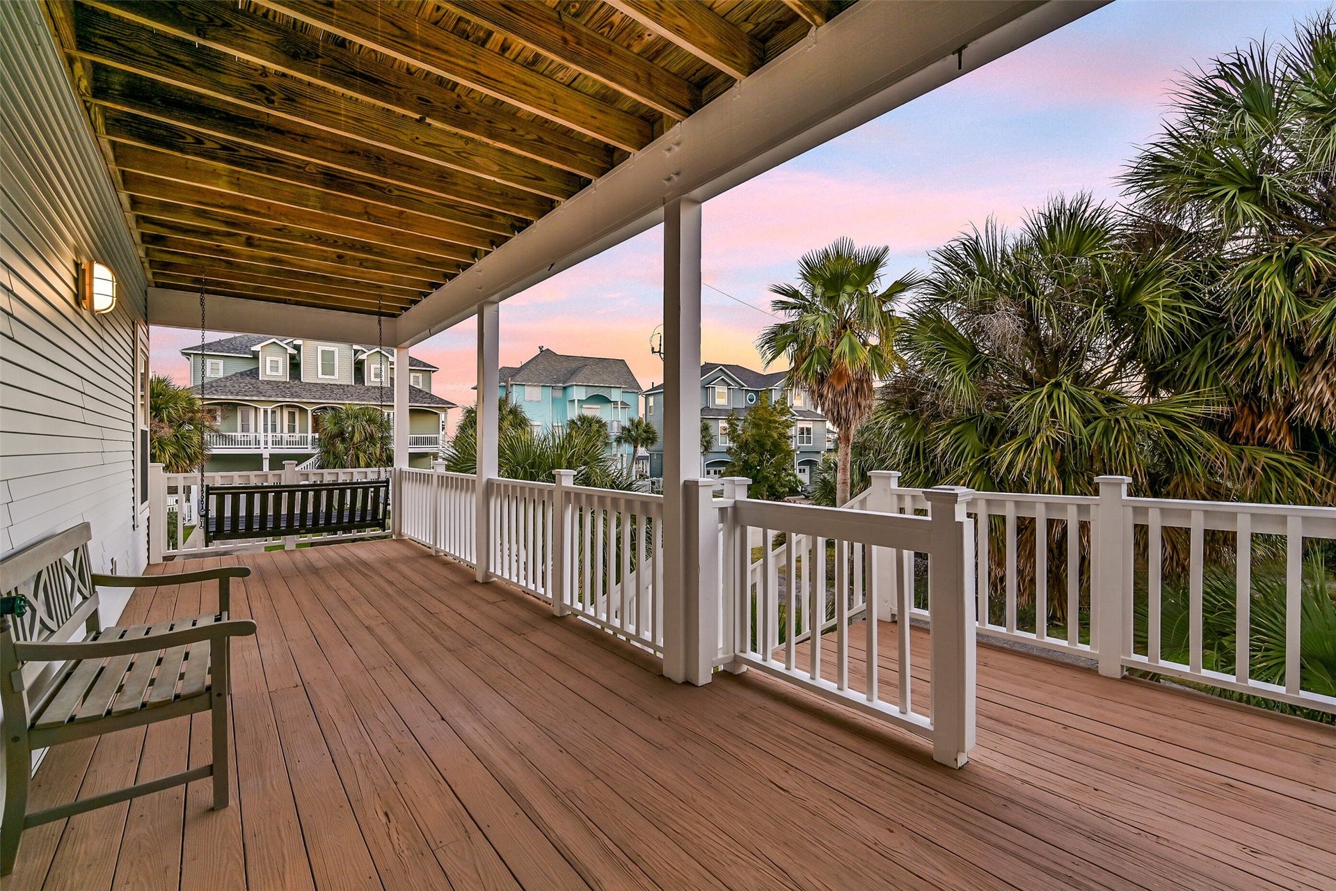 13414 Binnacle Way, Galveston, TX 77554 As you walk up the stairs you will be welcomed by a large covered deck by the entry way.