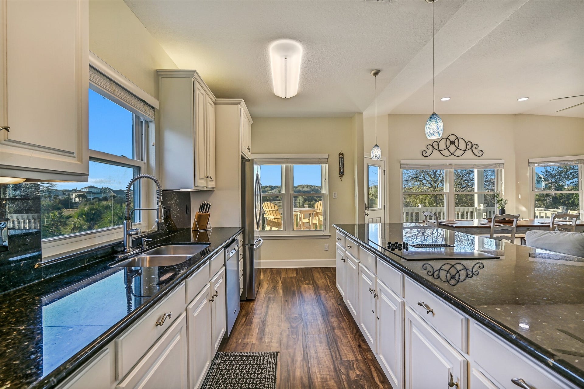 13414 Binnacle Way, Galveston, TX 77554 Expansive windows provide fantastic views while filling the home with natural light.