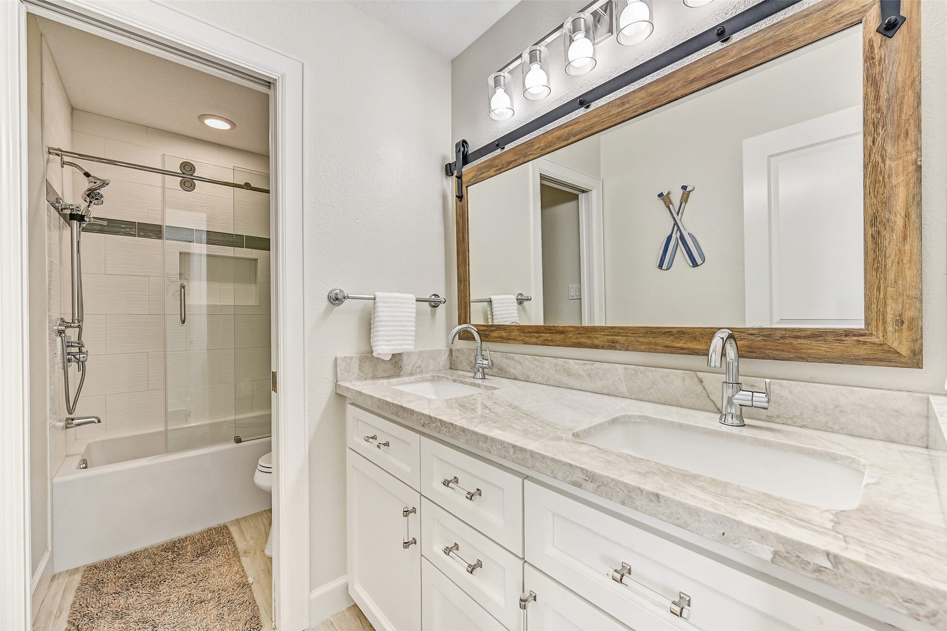13414 Binnacle Way, Galveston, TX 77554 The shared bathroom located conveniently between both guest bedrooms