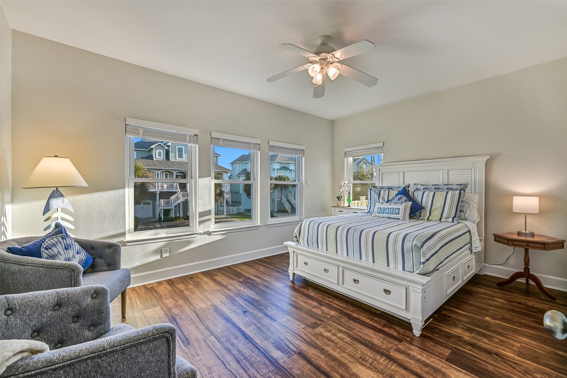 13414 Binnacle Way, Galveston, TX 77554 Privately tucked down the hall from the living room, the expansive primary suite features a luxurious en-suite bathroom.