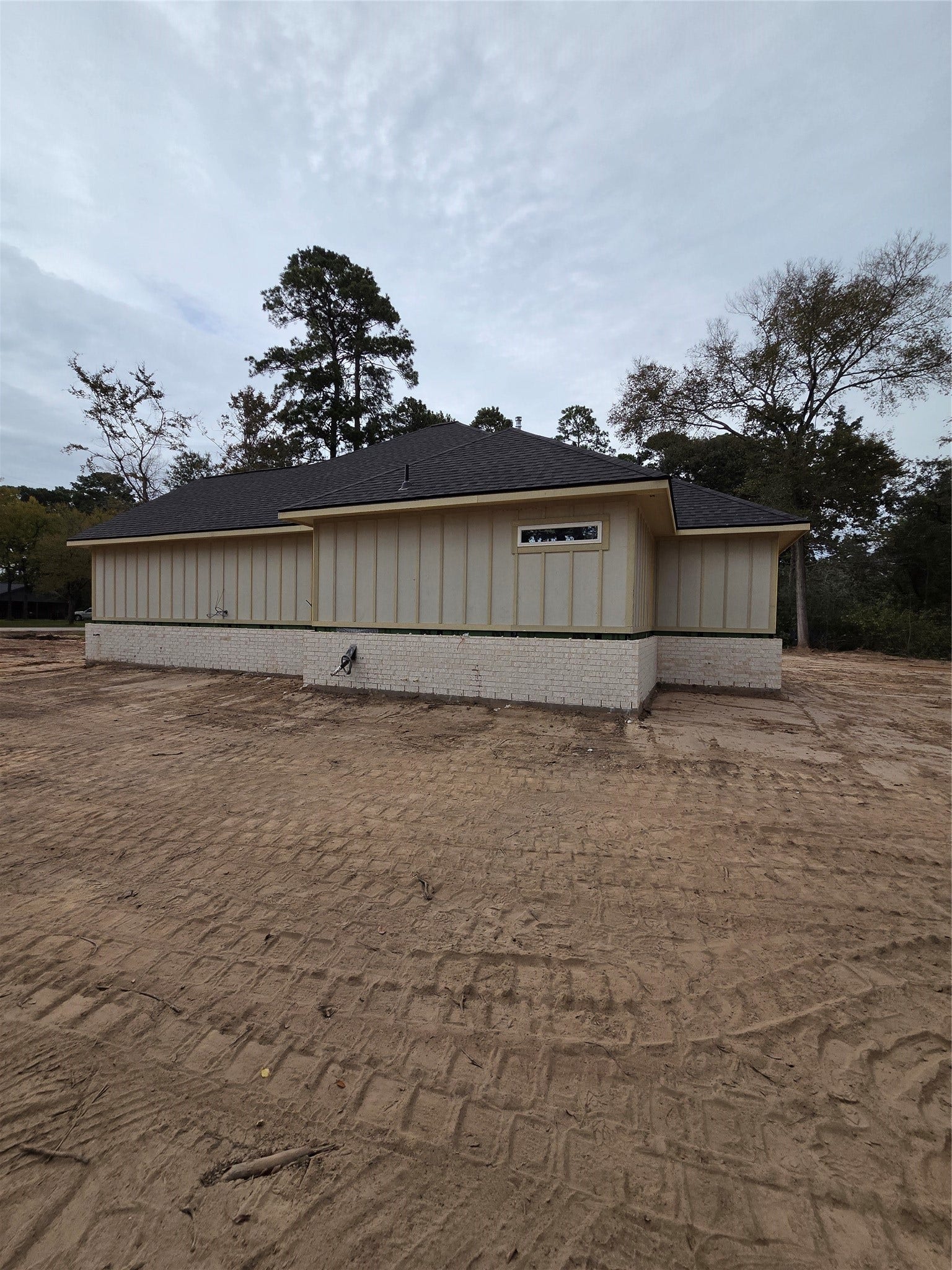 SIDE OF HOME WITH HIGH-QUALITY BRICK AND JAMES HARDI EXTERIOR
