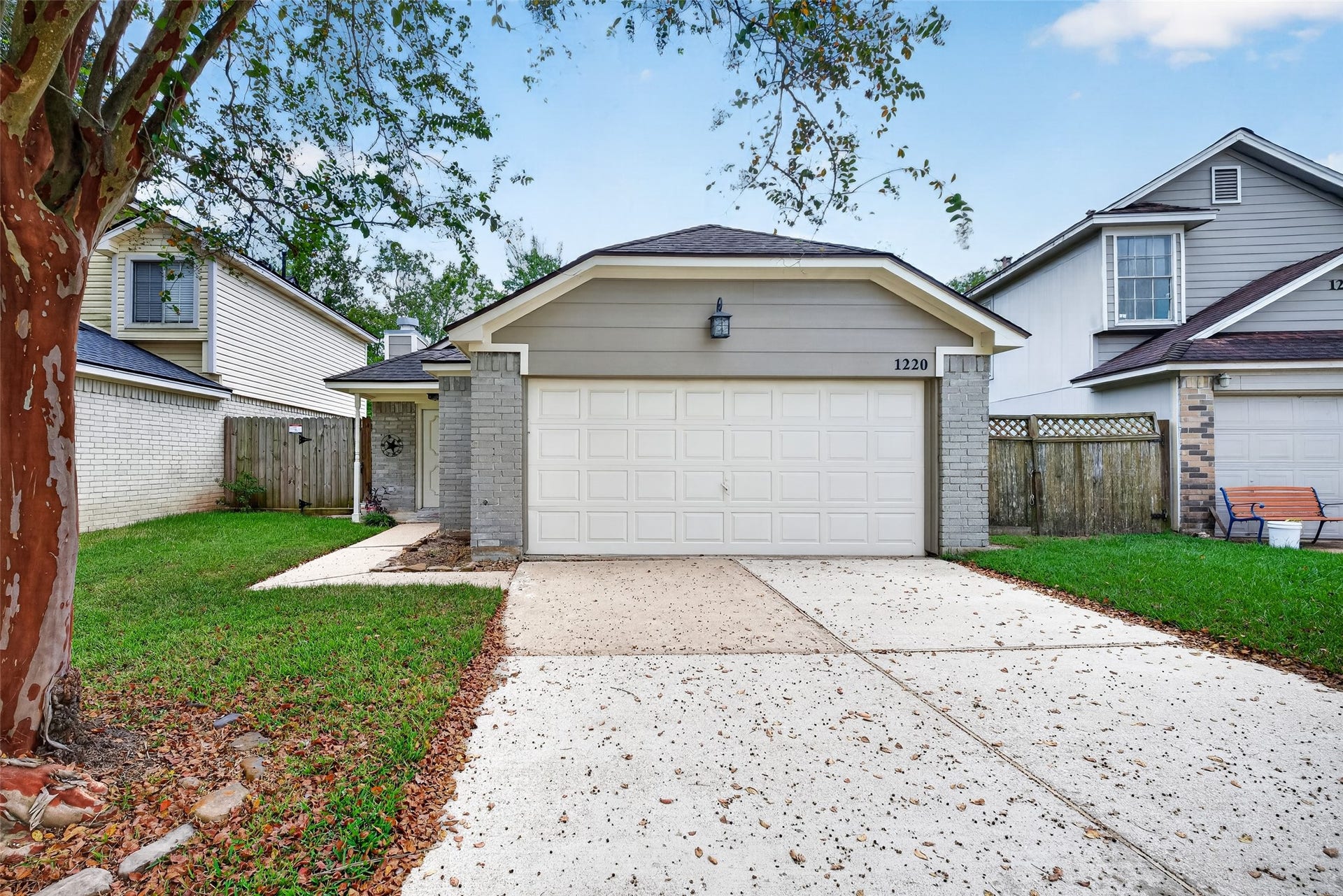 1220 Chelsea Lane, Pearland, TX 77581 Front exterior view featuring an attached two-car garage and covered entry.