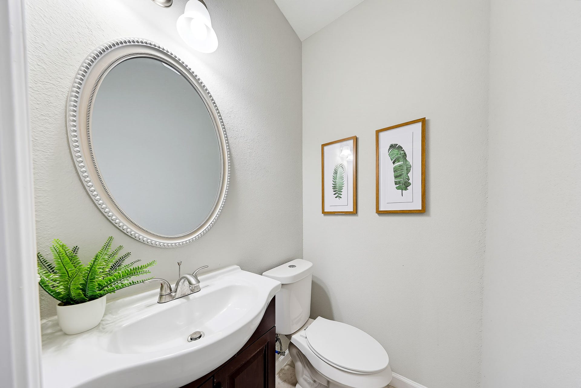 313 De Haven Street, Houston, TX 77029 A conveniently located half bath gives guests a space of their own.