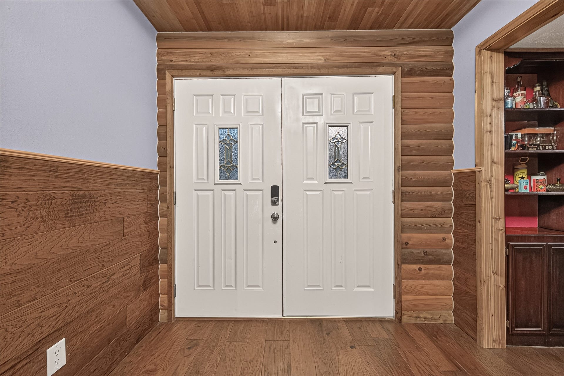 18614 Mink Lake Drive, Magnolia, TX 77355 Welcoming entry with double doors and warm wood accents.