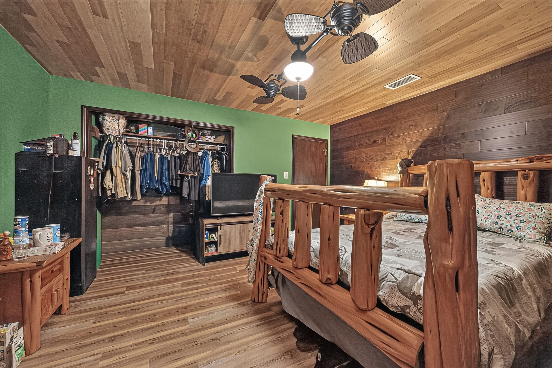 18614 Mink Lake Drive, Magnolia, TX 77355 nother view of the spacious bedroom highlighting the warm wood details.
