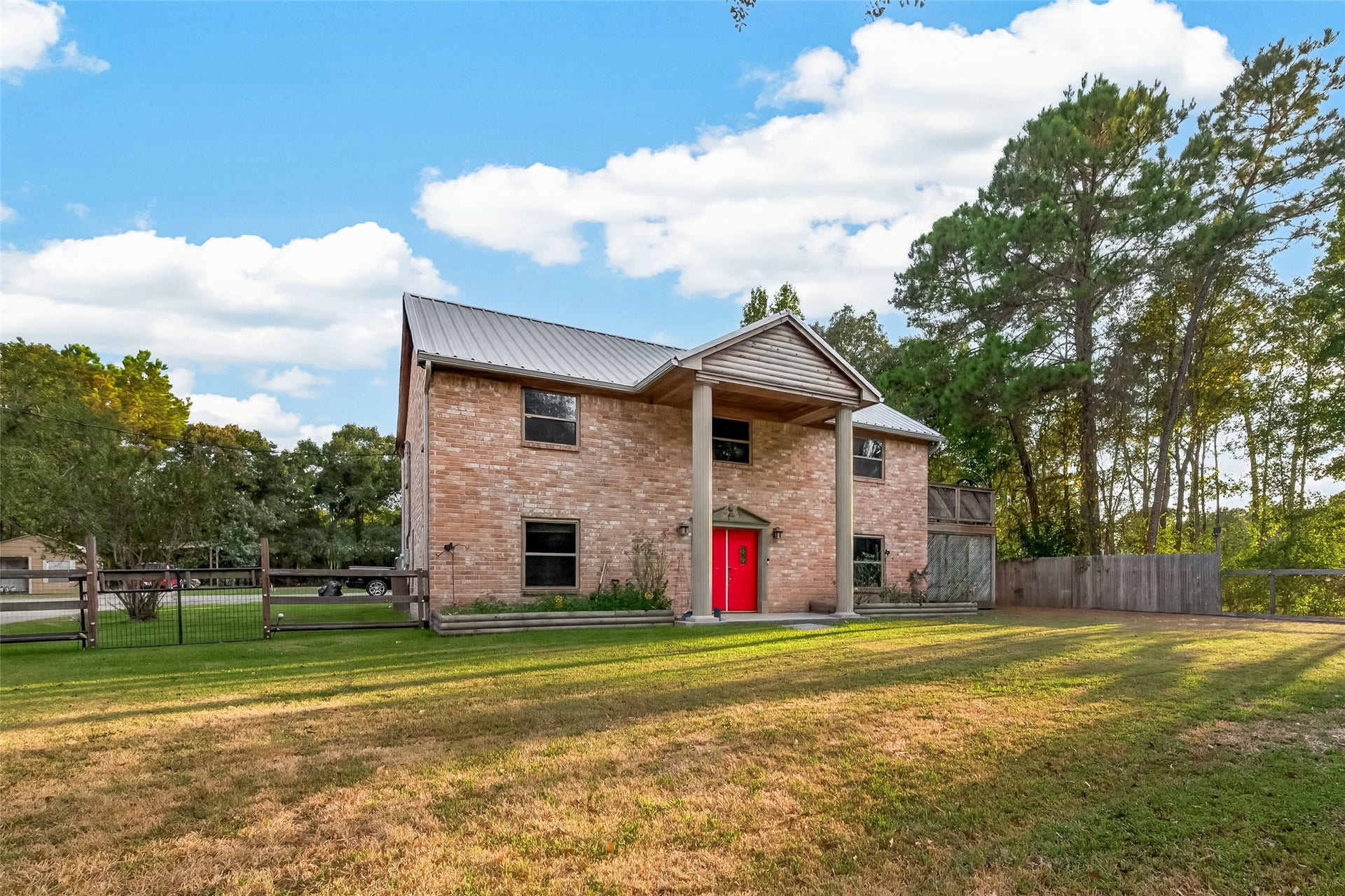 18614 Mink Lake Drive, Magnolia, TX 77355 Another exterior view highlighting the homes distinctive design and peaceful setting.