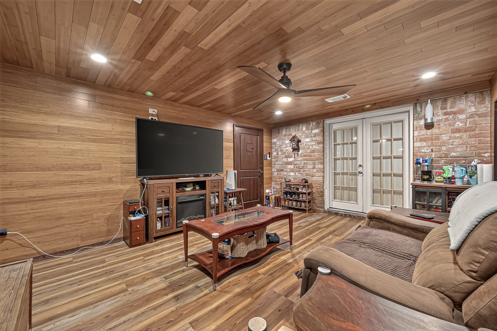 18614 Mink Lake Drive, Magnolia, TX 77355 Spacious living room with warm wood details and plenty of room to gather