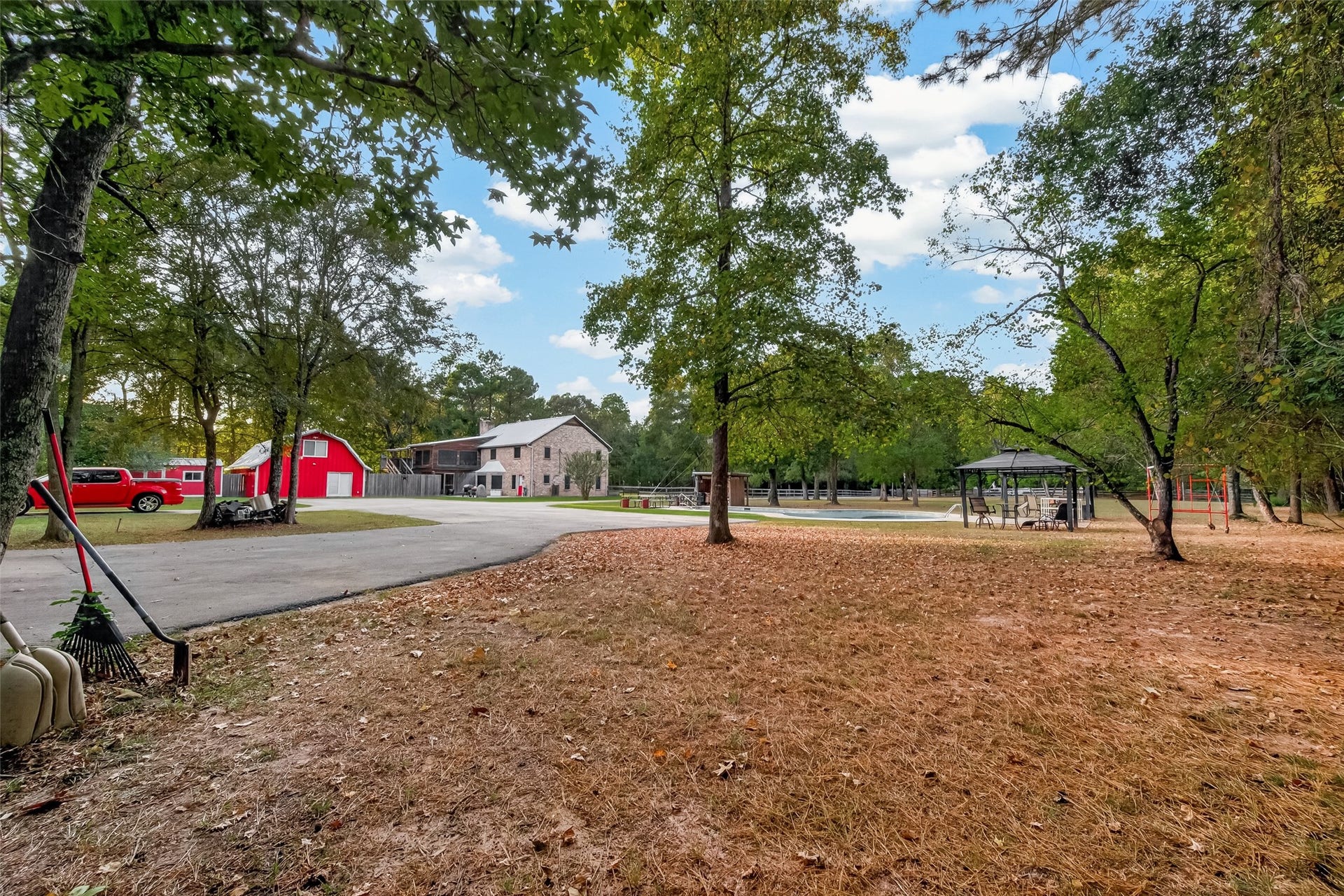 18614 Mink Lake Drive, Magnolia, TX 77355 pacious outdoor area surrounded by mature trees and natural shade.