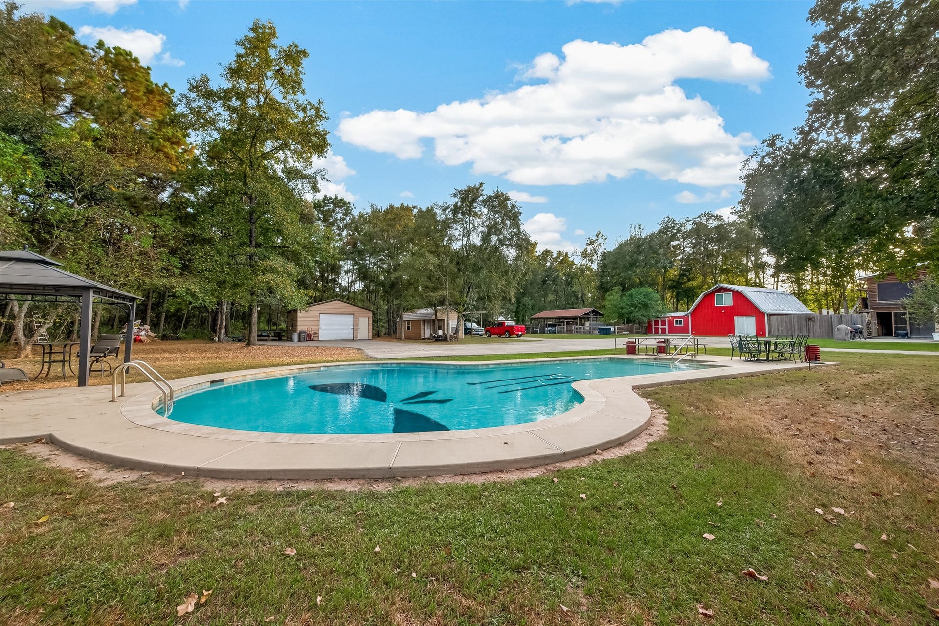 18614 Mink Lake Drive, Magnolia, TX 77355 Another view of the pool and spacious outdoor setting.