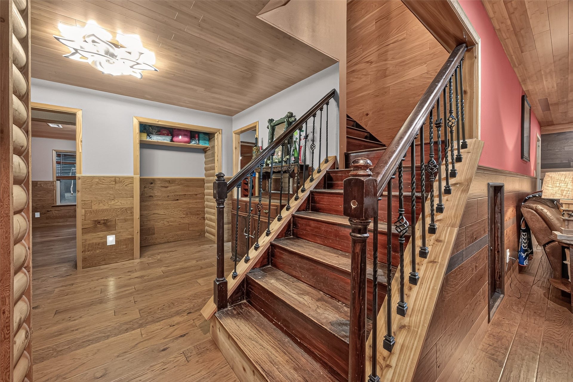 18614 Mink Lake Drive, Magnolia, TX 77355 Grand staircase adds character to the inviting interior.