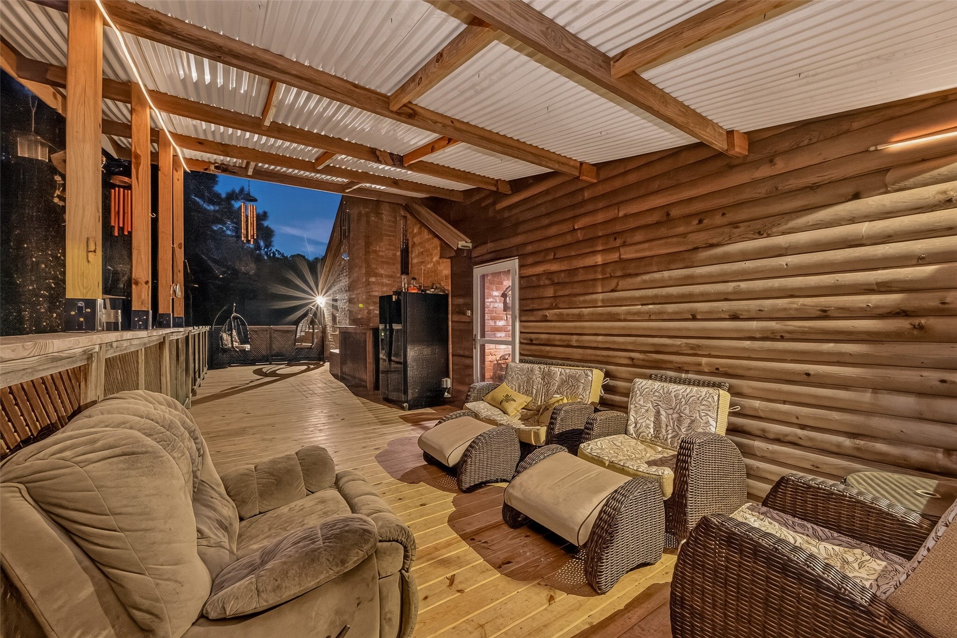 18614 Mink Lake Drive, Magnolia, TX 77355 Another view of the covered outdoor living space with a warm, inviting feel.