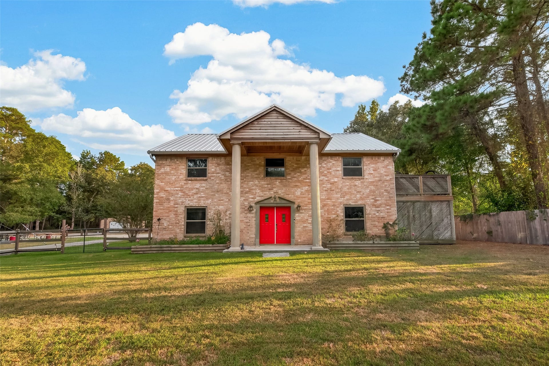 18614 Mink Lake Drive, Magnolia, TX 77355 Impressive two-story home set on a spacious lot surrounded by mature trees.