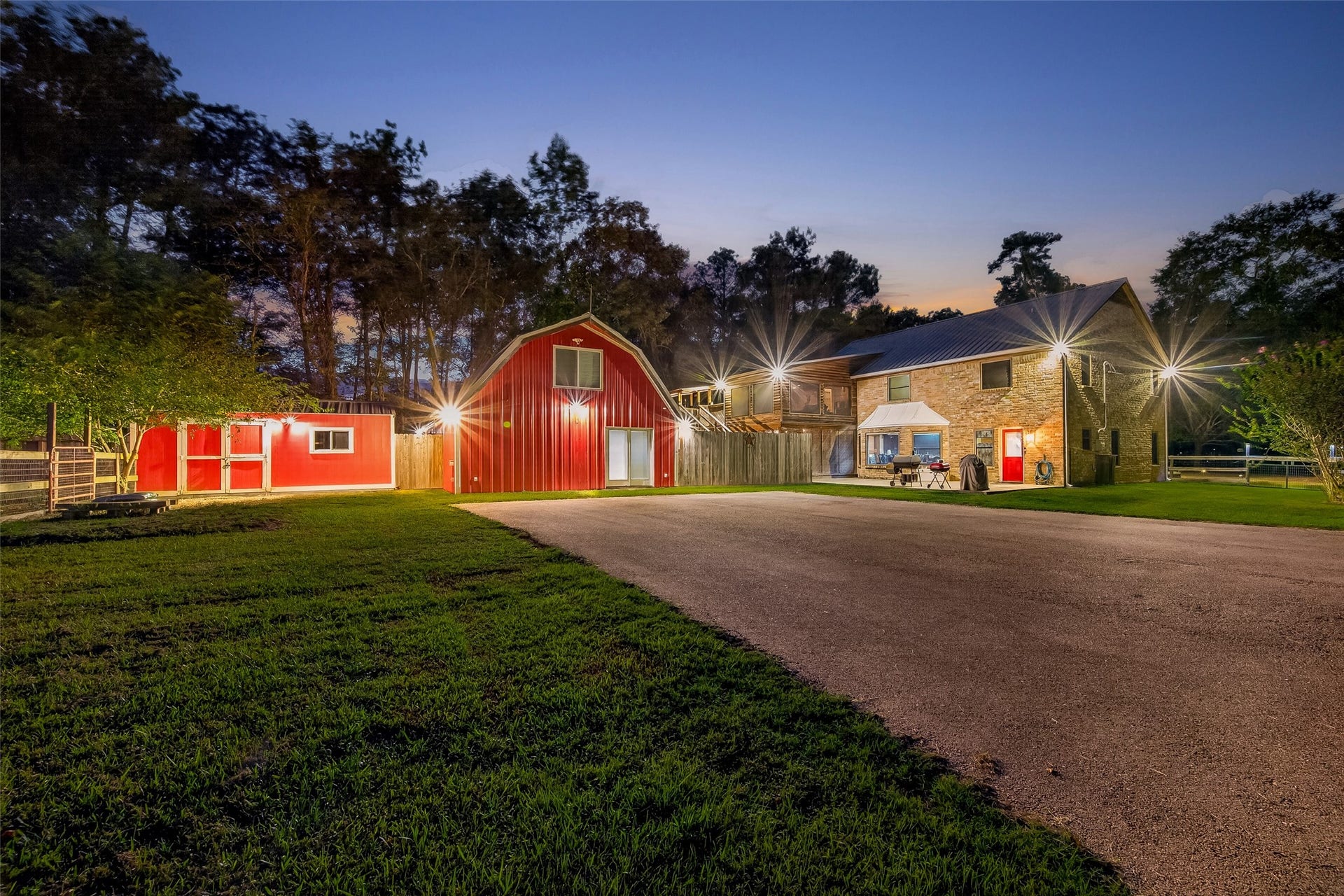 18614 Mink Lake Drive, Magnolia, TX 77355 Evening exterior view showcasing the property and outdoor spaces.