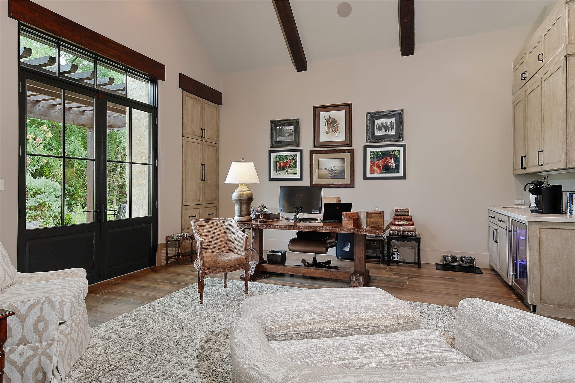 The second office features a comfortable sitting area, large storage room, built-ins for a coffe station, refrigerator and private access to the covered pergola. Comfort and functionality make this room a sanctuary to work in.