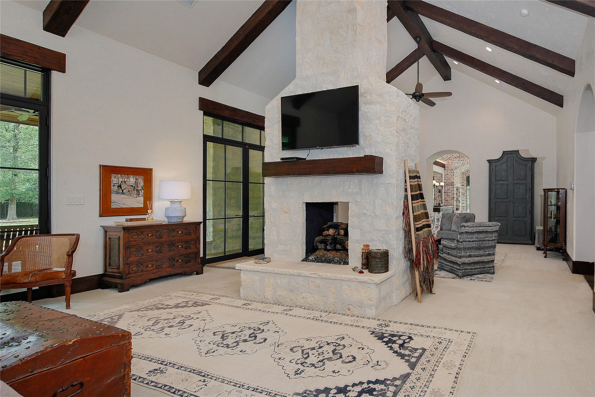 This fireplace cleverly divides the sleeping area from the sitting area.
