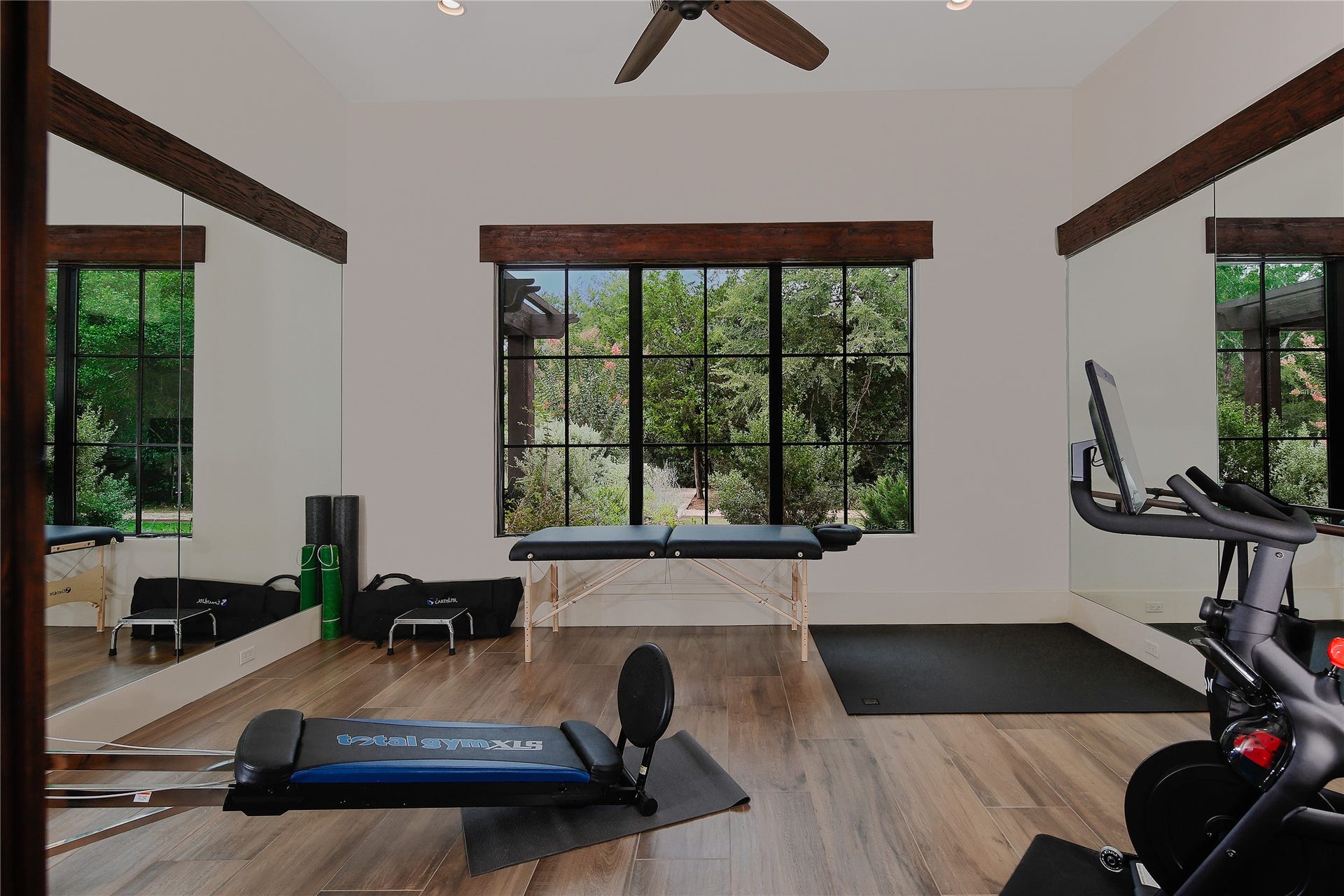 The exercise room located next to the primary suite also provides attic access via remote controlled drop-down stairs.