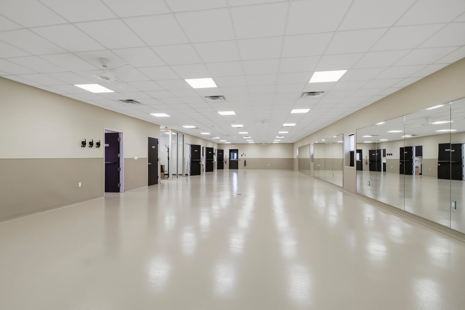 Huge open area with durable epoxy flooring. Additional rooms include an office, kitchen, break room, laundry & storage rooms.