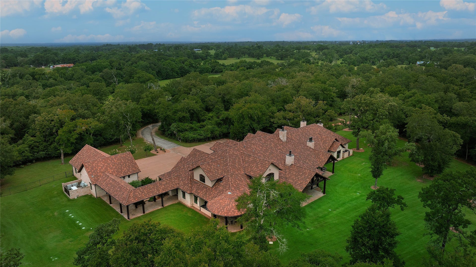 An aerial view showing the beauty of this one of a kind estate. In addition to the gated entry a perimeter fence is 7 feet tall and buried into the ground to keep out annoying critters and to provide additional security.