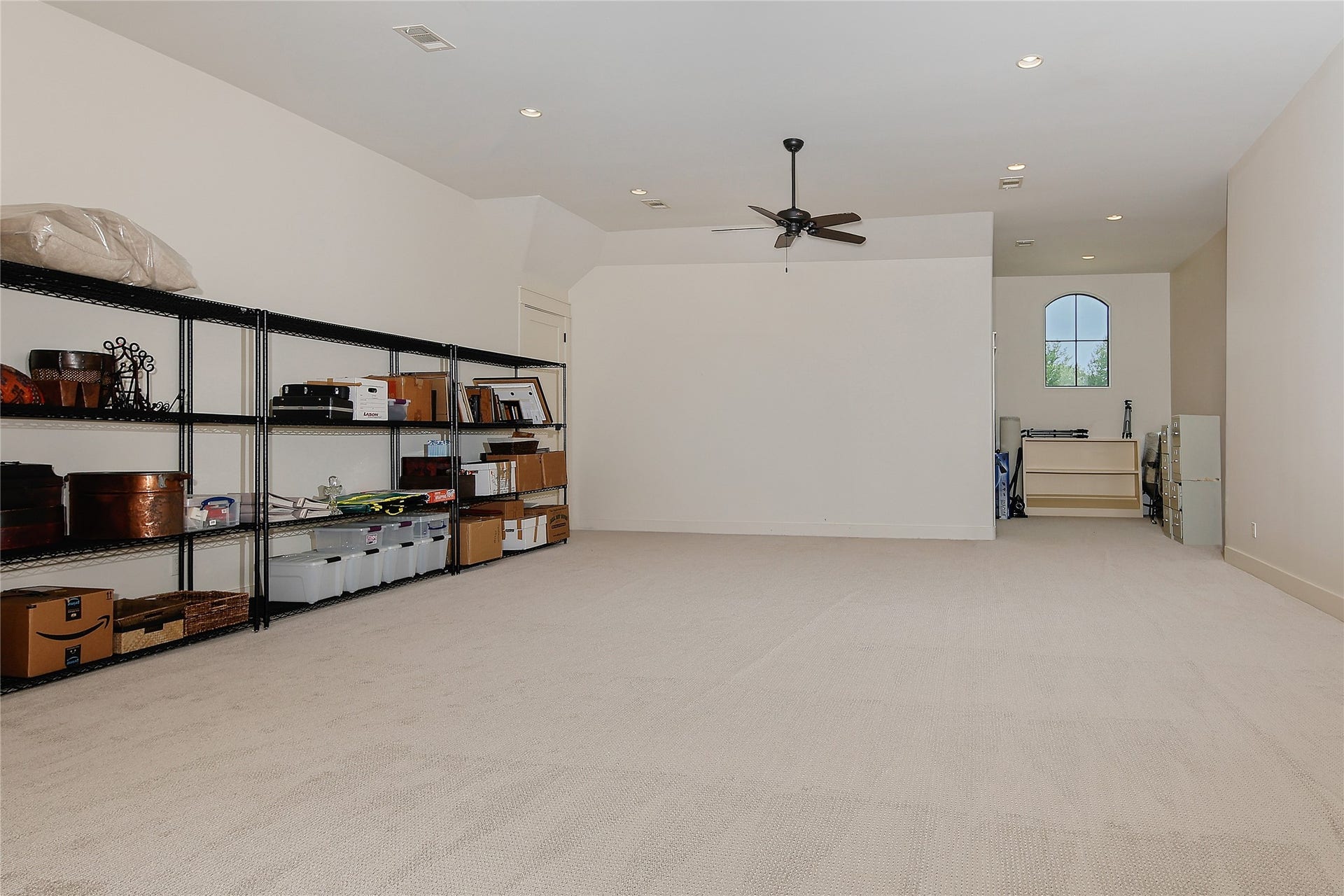 A stunning stone and tile accent staircase takes you upstairs to this huge bonus room. The whole house electronics and breaker boxes are housed in a room off to the left. In addition there are two more large secondary bedrooms upstairs each with private ensuite bathrooms.