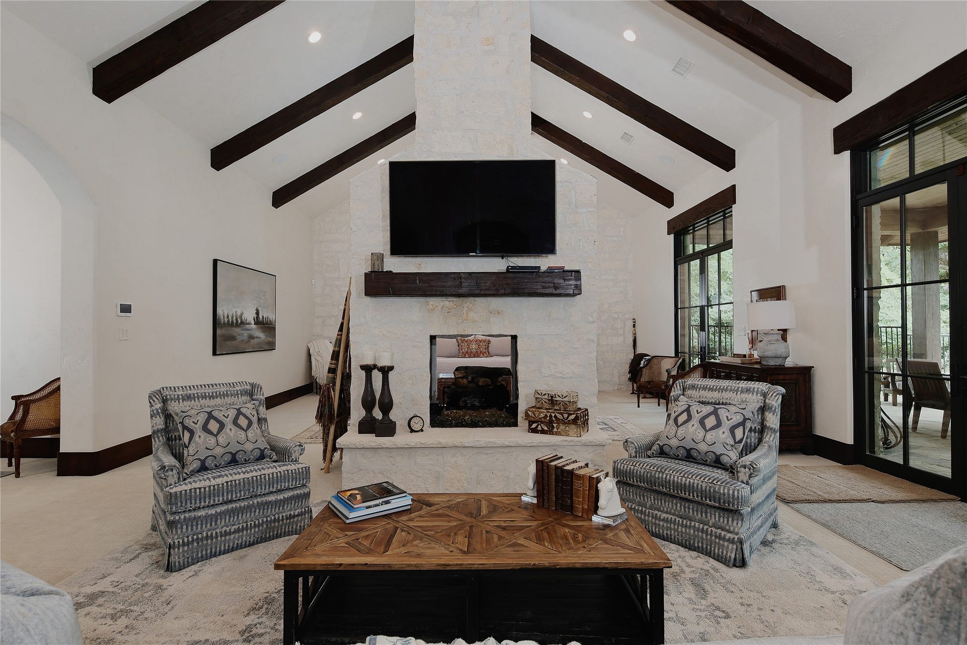 The scenic views of the backyard and plenty of natural light create an atmosphere of complete relaxation.