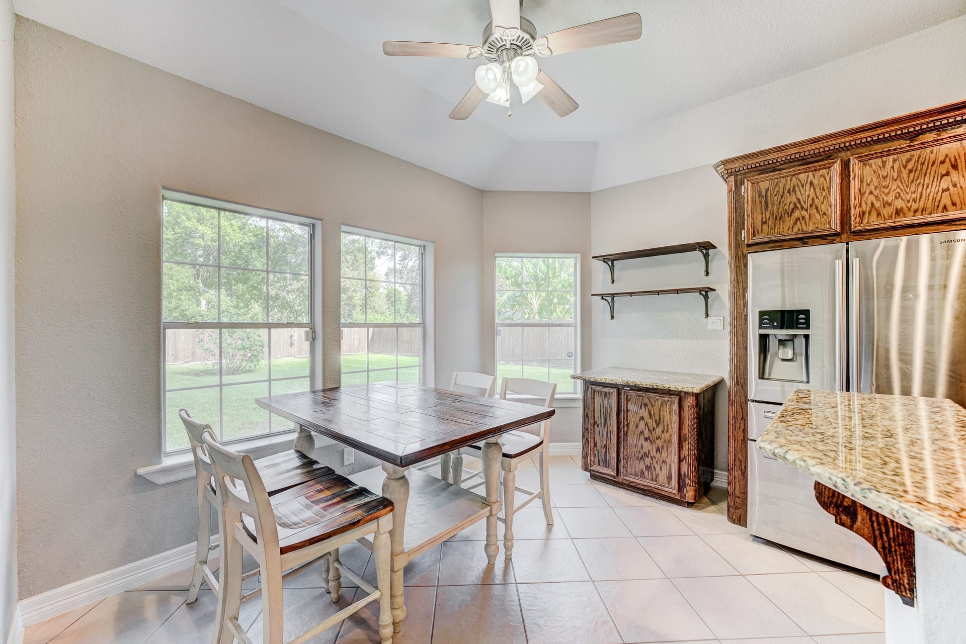 Sunny breakfast area overlooking the backyard and open to the kitchen.