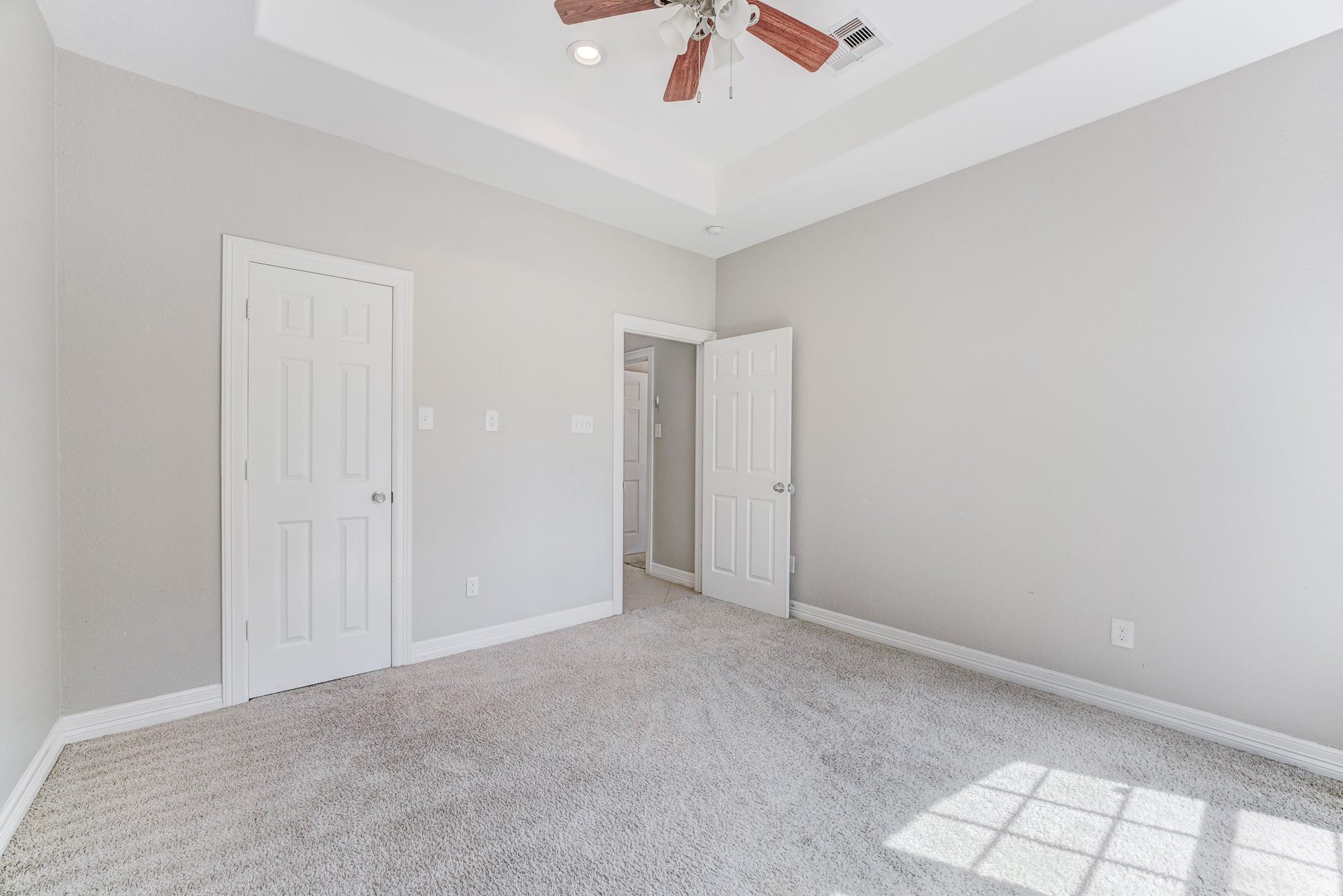 Spacious bedroom offering neutral finishes and excellent closet space.