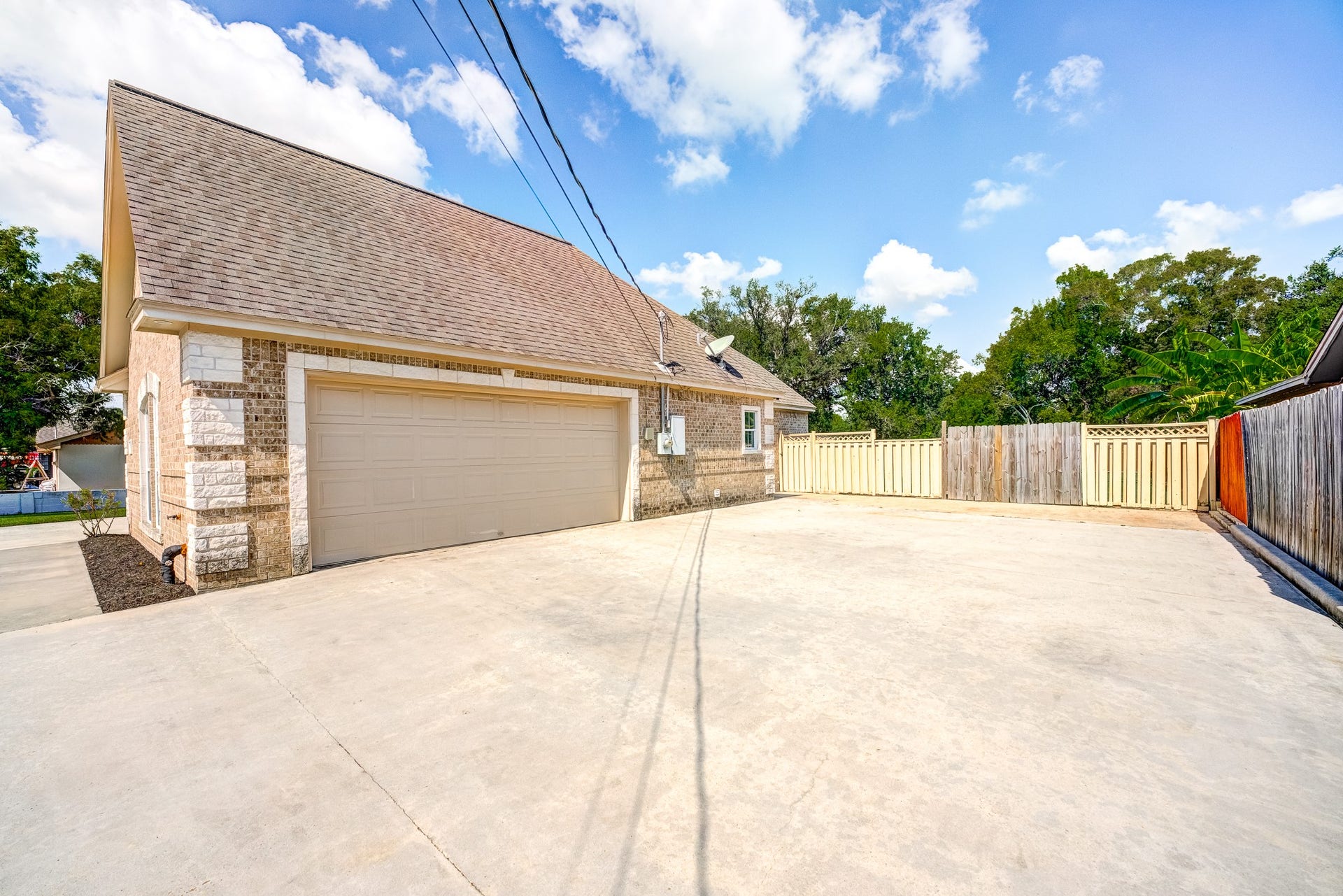 Oversized garage and extended concrete driveway with plenty of parking space. Bring your boat or RV!