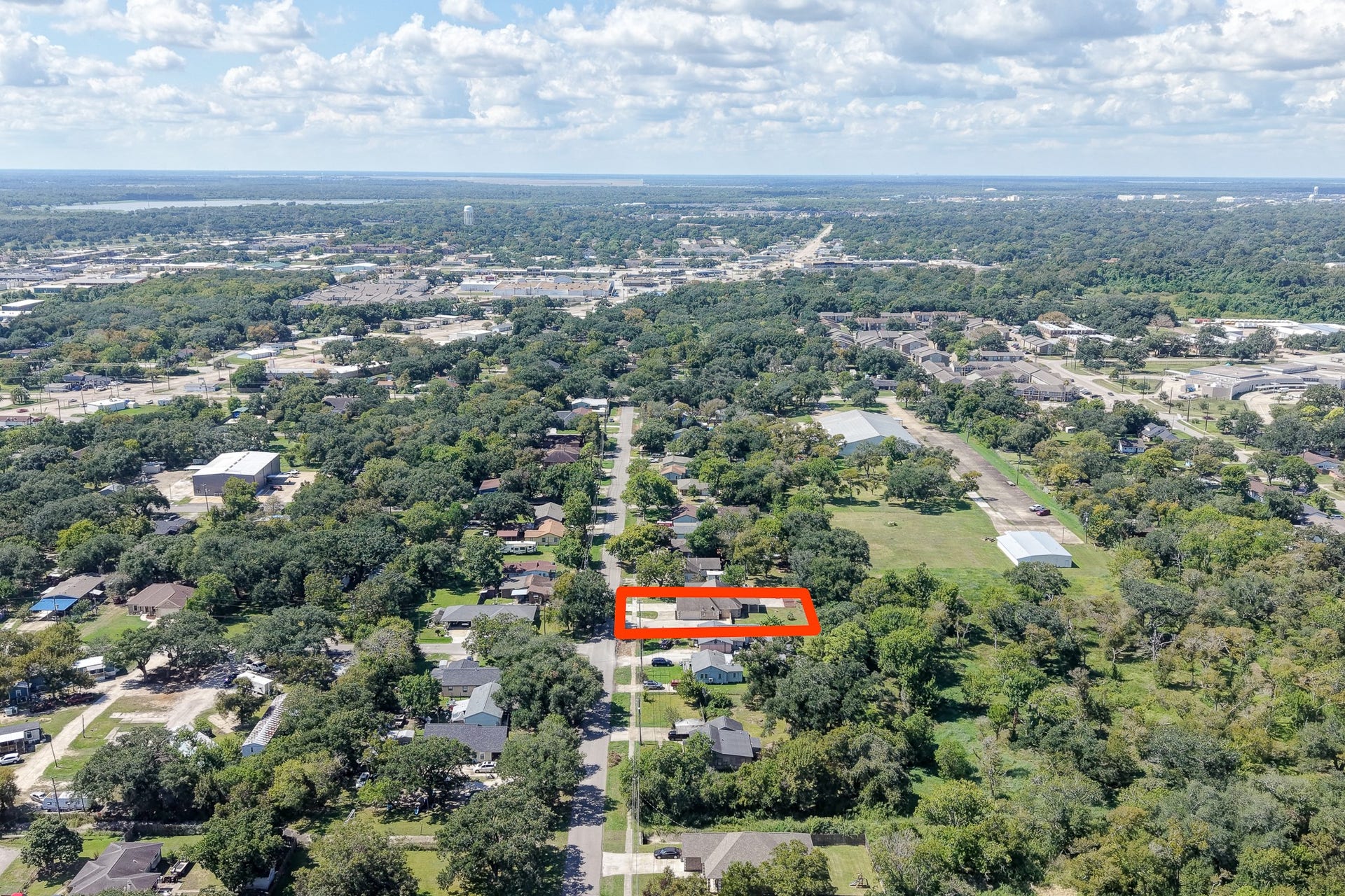 Wide aerial perspective providing a look at the surrounding community and neighborhood setting.