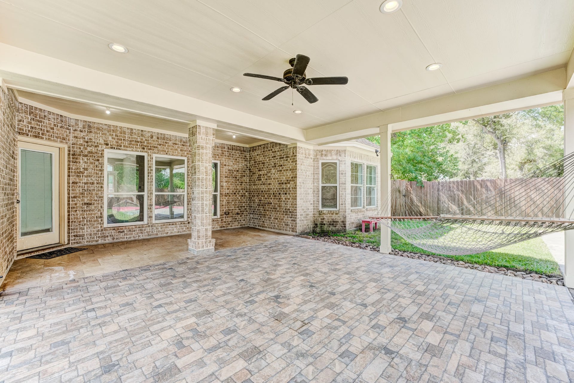 Expansive covered patio ideal for outdoor dining, entertaining, and relaxation.