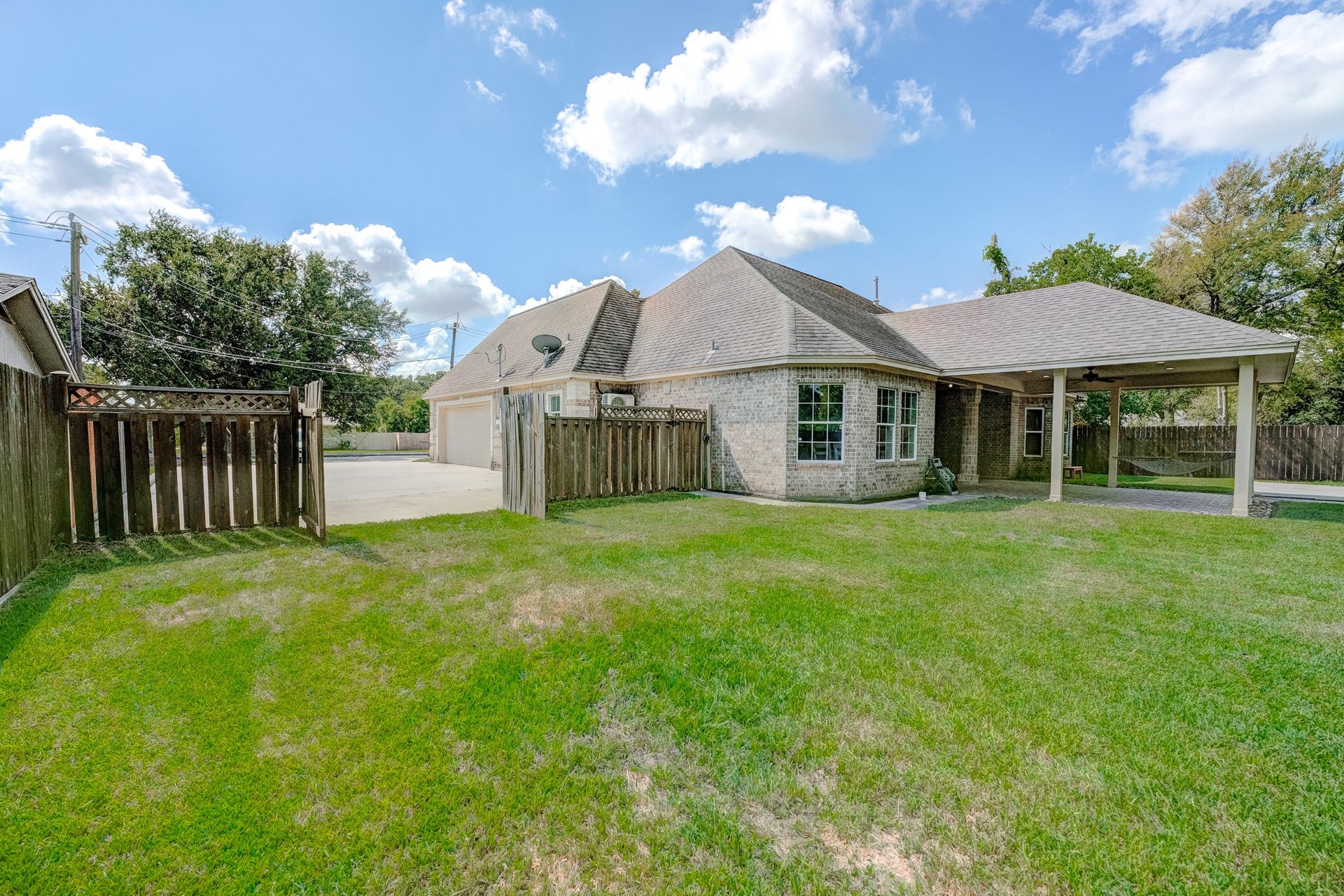 Fully fenced backyard offering privacy and plenty of room for outdoor activities.