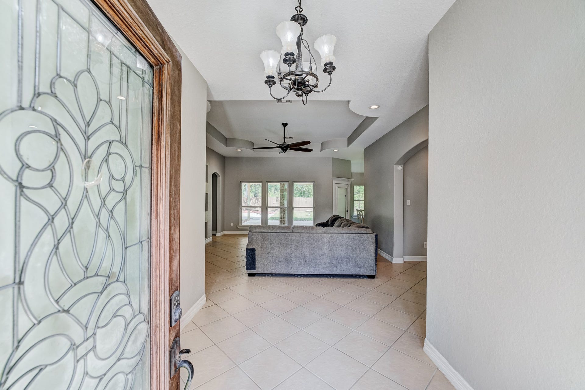 Bright foyer with soaring ceilings and an open-concept layout.