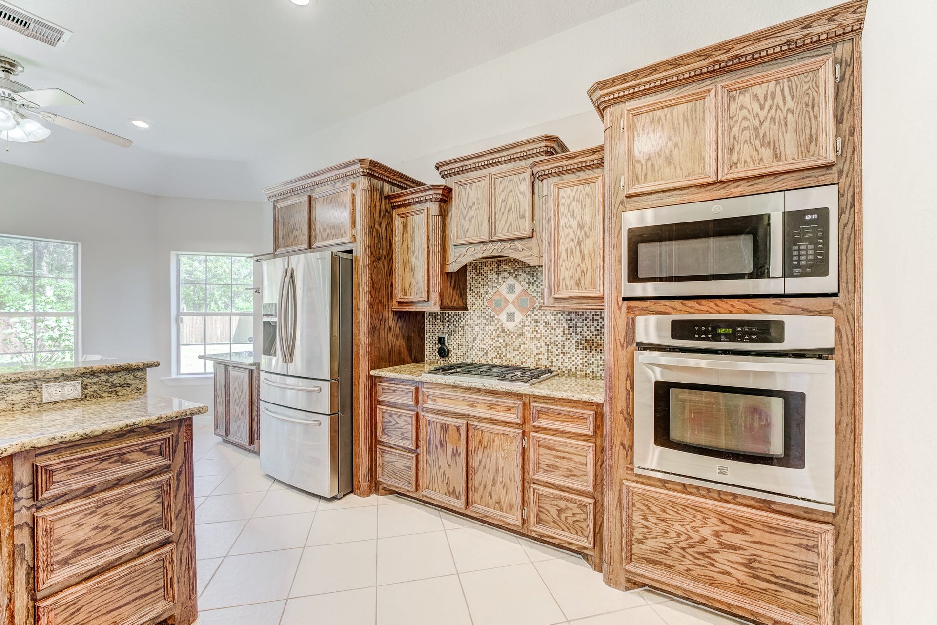 Expansive kitchen offering ample cabinet storage and workspace.